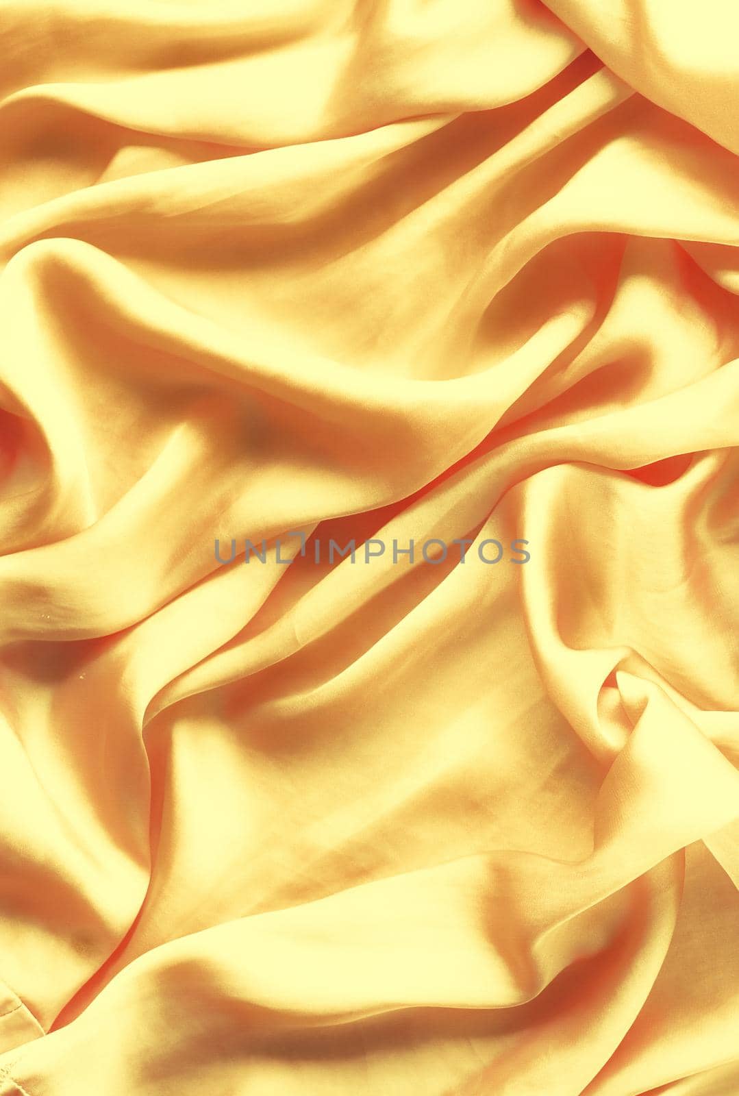 Luxury golden silk background texture - elegant fabric textures, abstract backgrounds and modern pastel colours concept