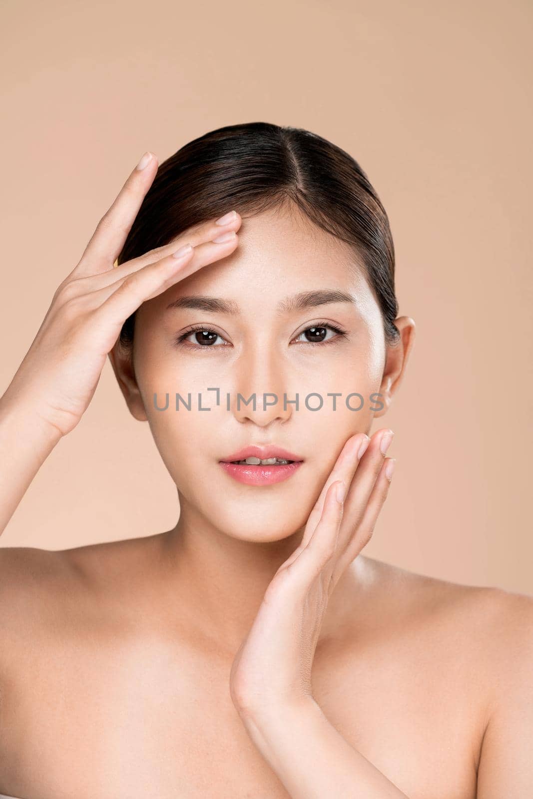 Closeup ardent young woman posing beauty gesture with clean fresh skin. by biancoblue