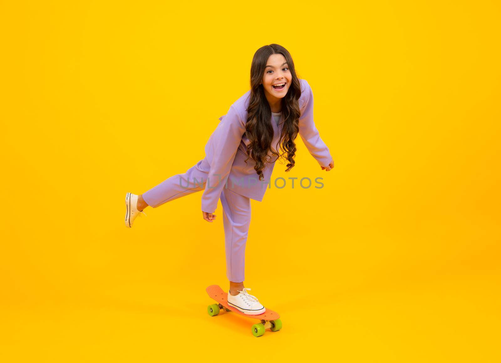 Teen hipster girl skater with skateboard on isolated background. Summer kids trend, urban teenage style. by RedFoxStudio