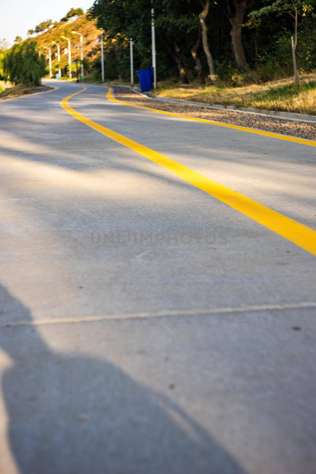 Running road around the Lisi lake in sunny day