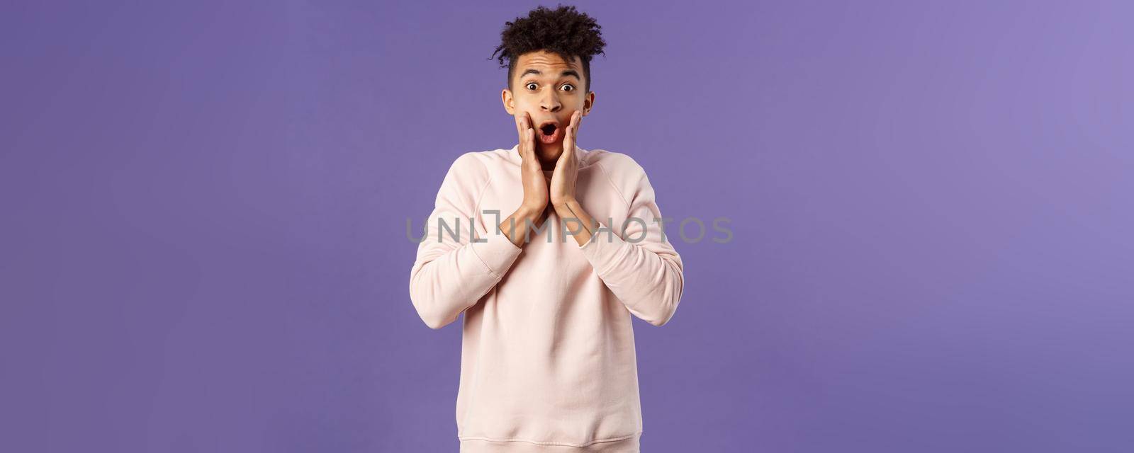 Oh my gosh. Portrait of amazed, speechless excited hispanic guy staring overwhelmed at something stunning, watching incredible performance, react shocked and amazed, purple background by Benzoix