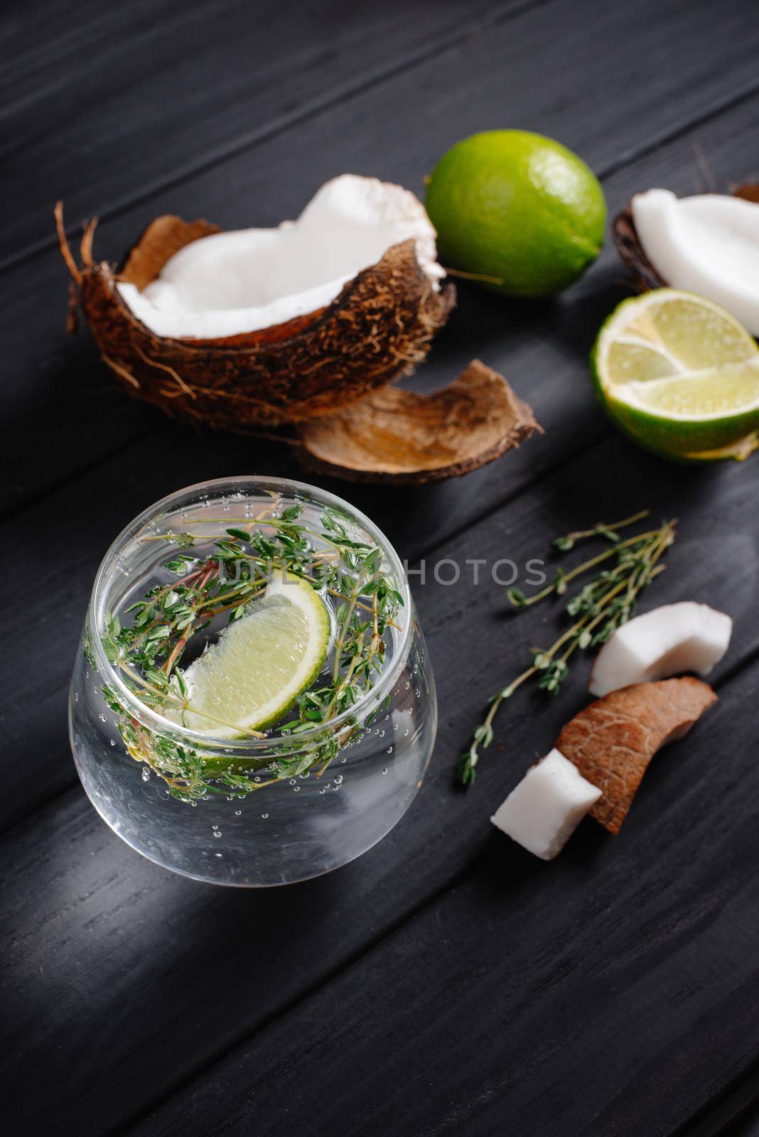 hard seltzer with coconut on a dark background. Vertical shoot