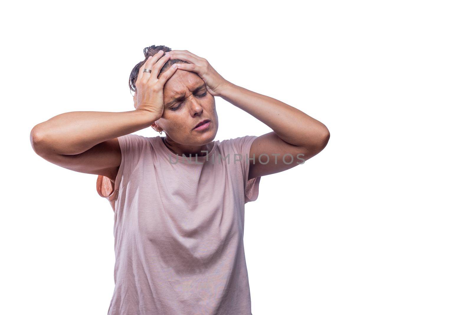 Front view of a adult female with severe headache on a white background