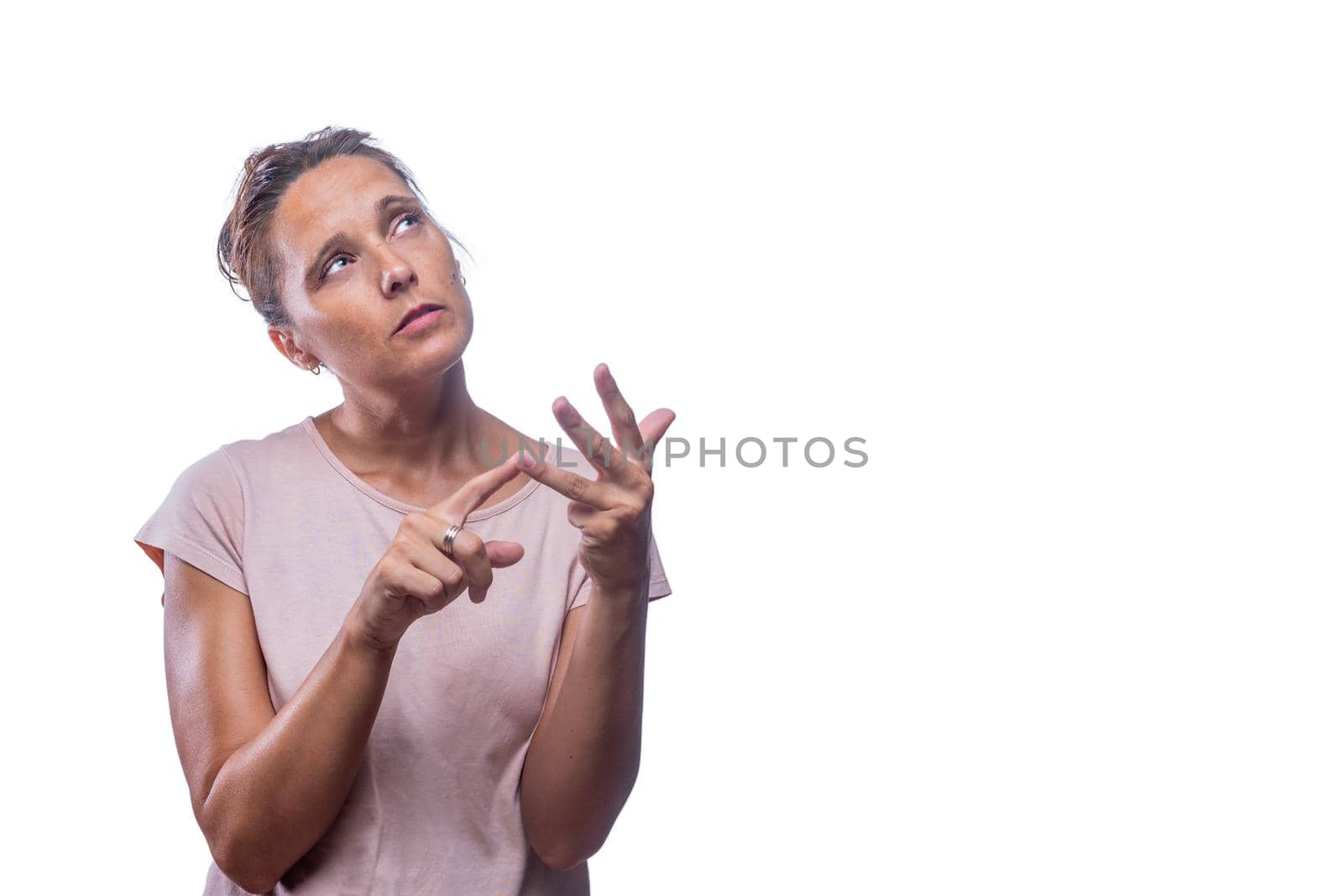 pensive woman counting on her fingers on a white background by ivanmoreno