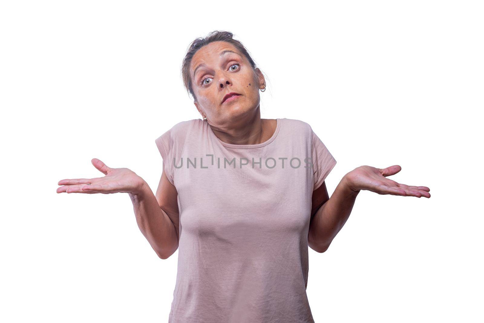 Front view of a resigned green-eyed woman with palms up on a white background with copy space.