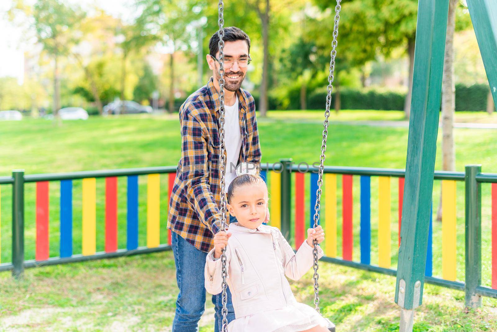 A young man playing with his adopted daughter by ivanmoreno