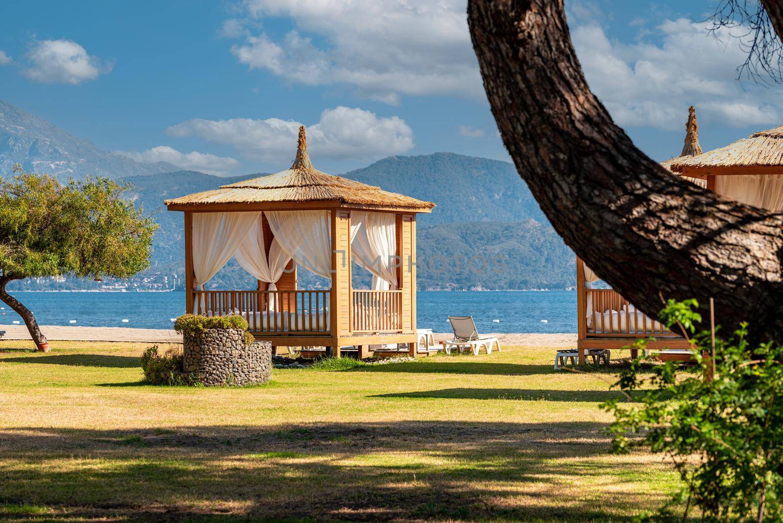 Luxurious and comfortable cabana among the trees on the hotel beach by Sonat