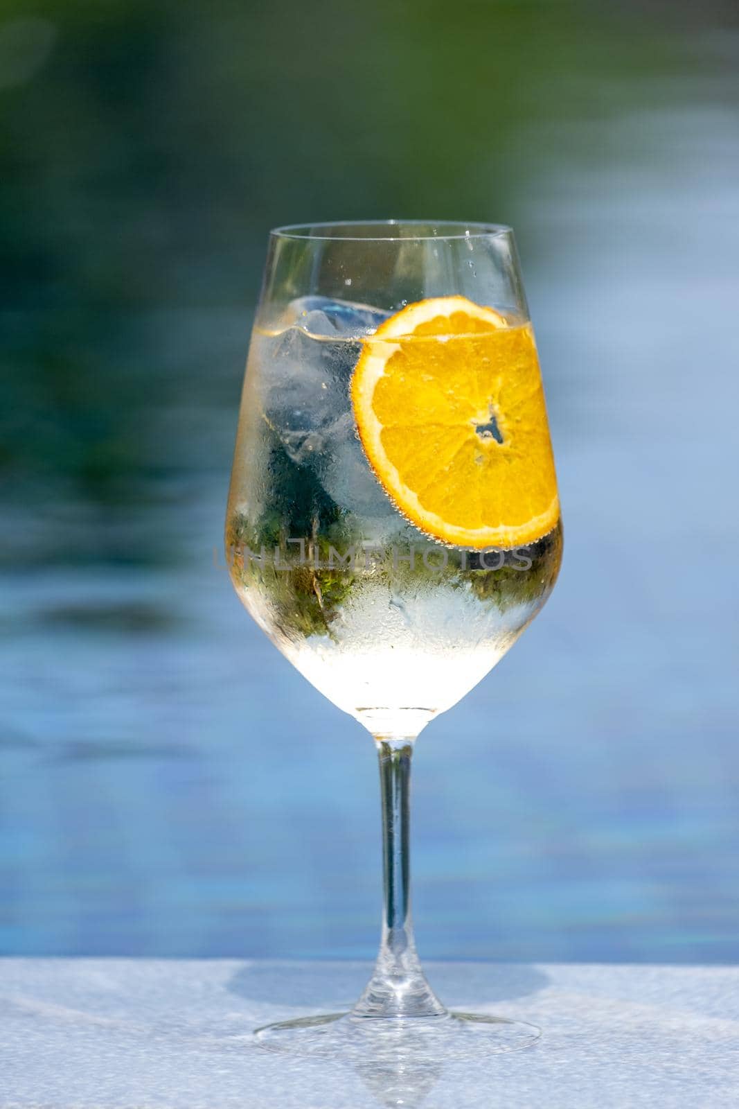 Refreshing fruity and alcoholic summer cocktail on dark background