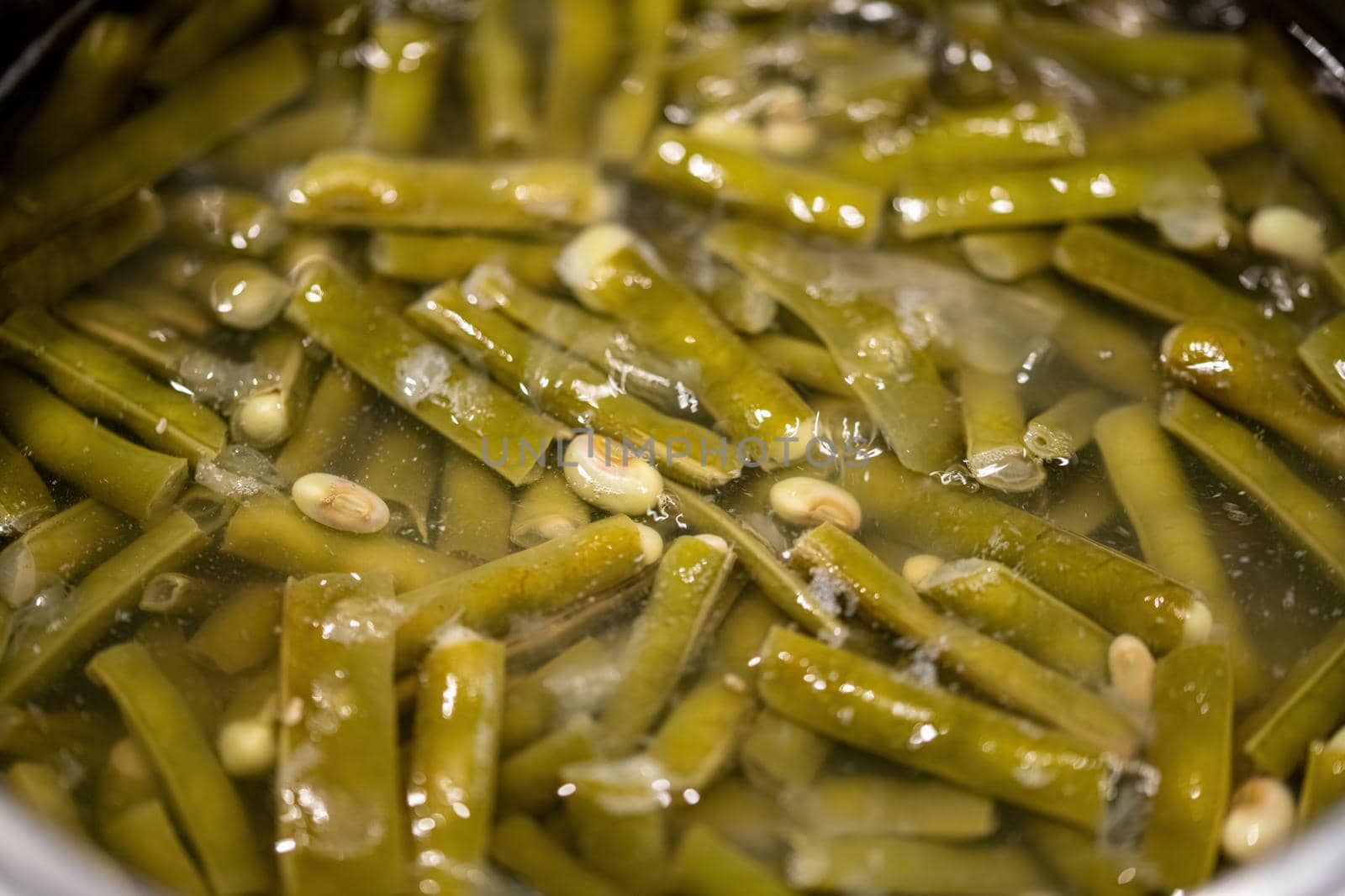 Green bean boiled in water in a pot. Selective Focus