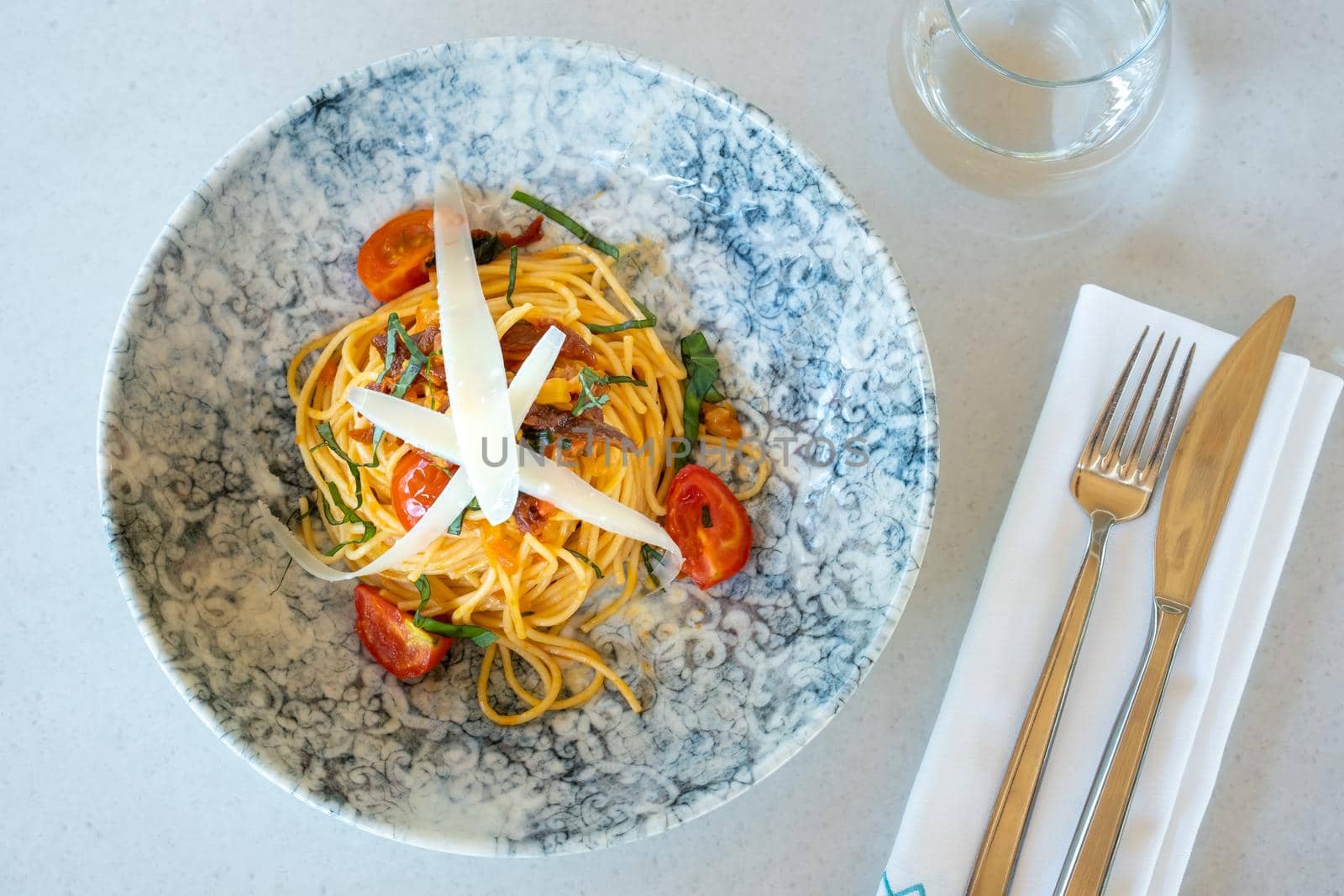Spaghetti with a spicy sauce, chili pepper and grated parmesan cheese by Sonat