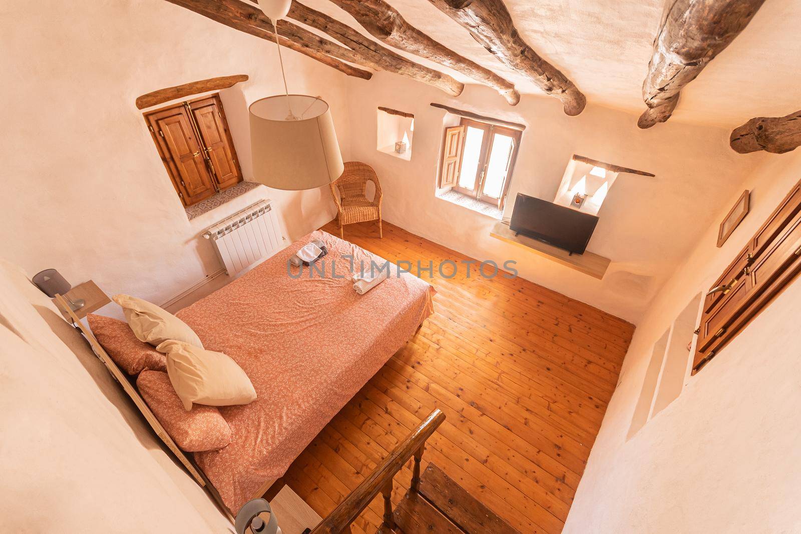 View from above of a cozy bedroom of a rural hotel in Almeria, Spain. Concept of travel and lodging.