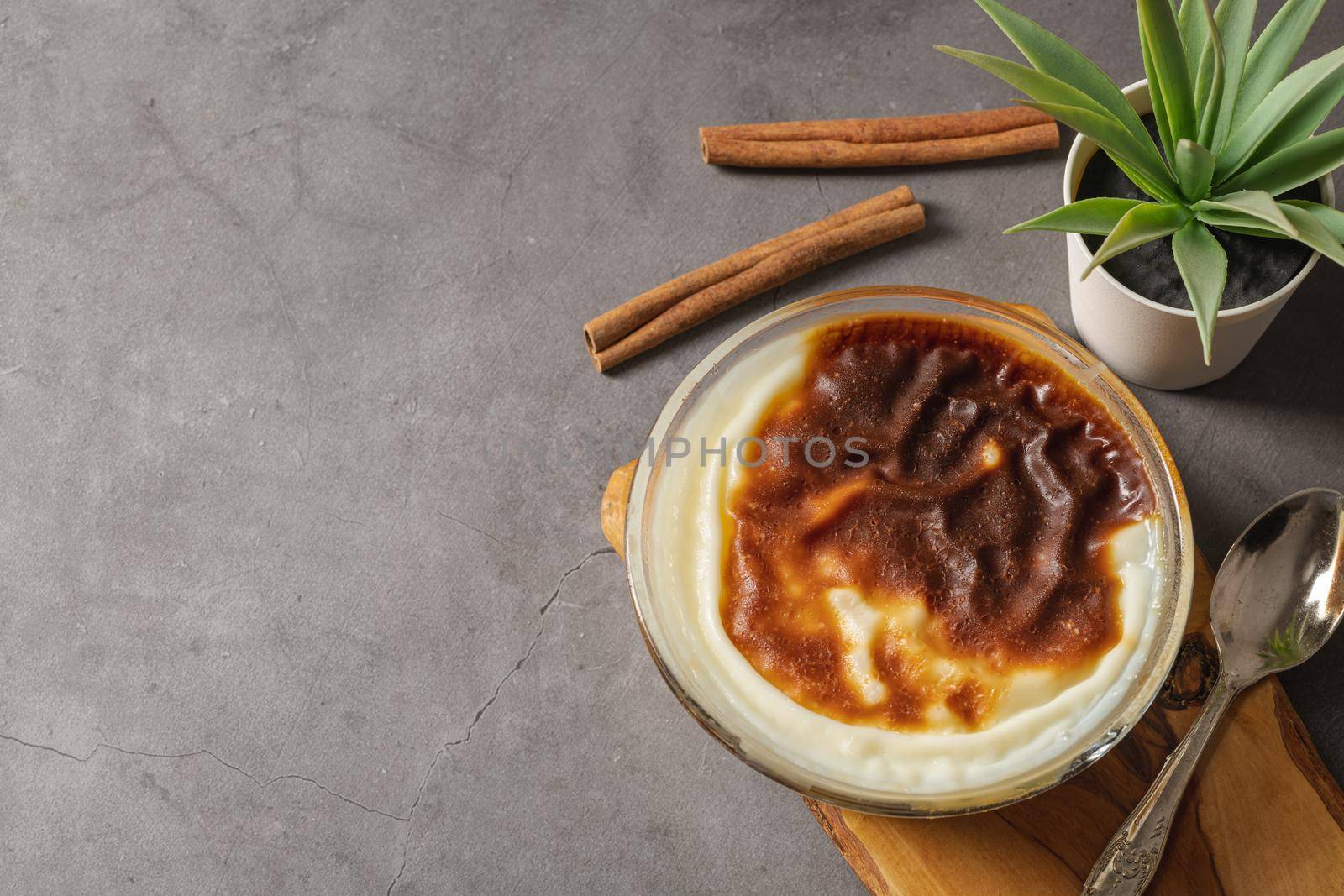 Traditional turkish dessert bakery rice pudding Turkish name Fırın Sutlac in glass bowl