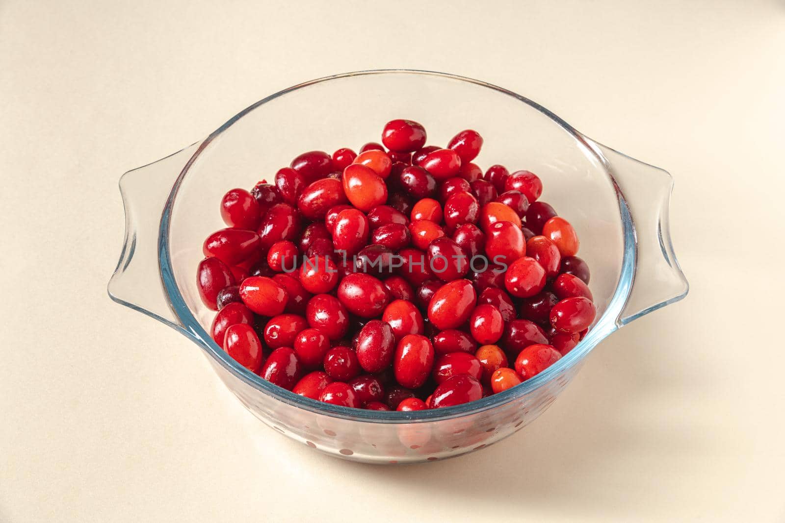 Fresh cranberries in a glass bowl. Healthy eating concept