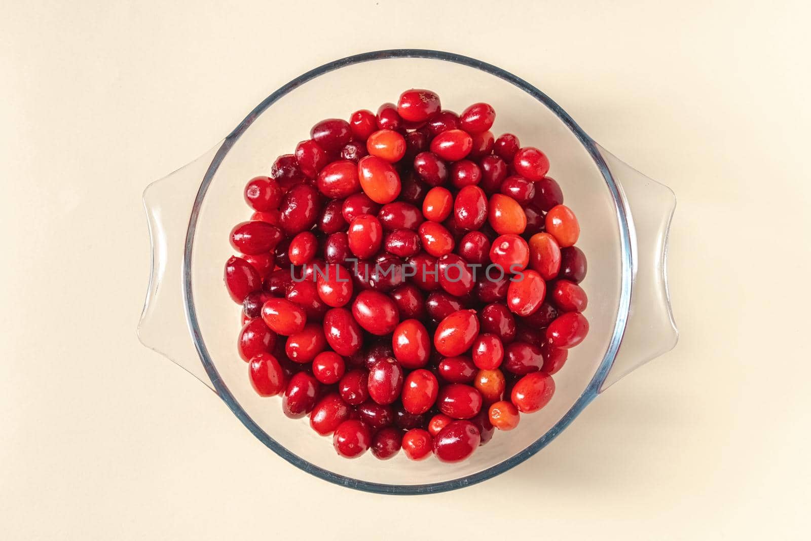 Fresh cranberries in a glass bowl. Healthy eating concept by Sonat