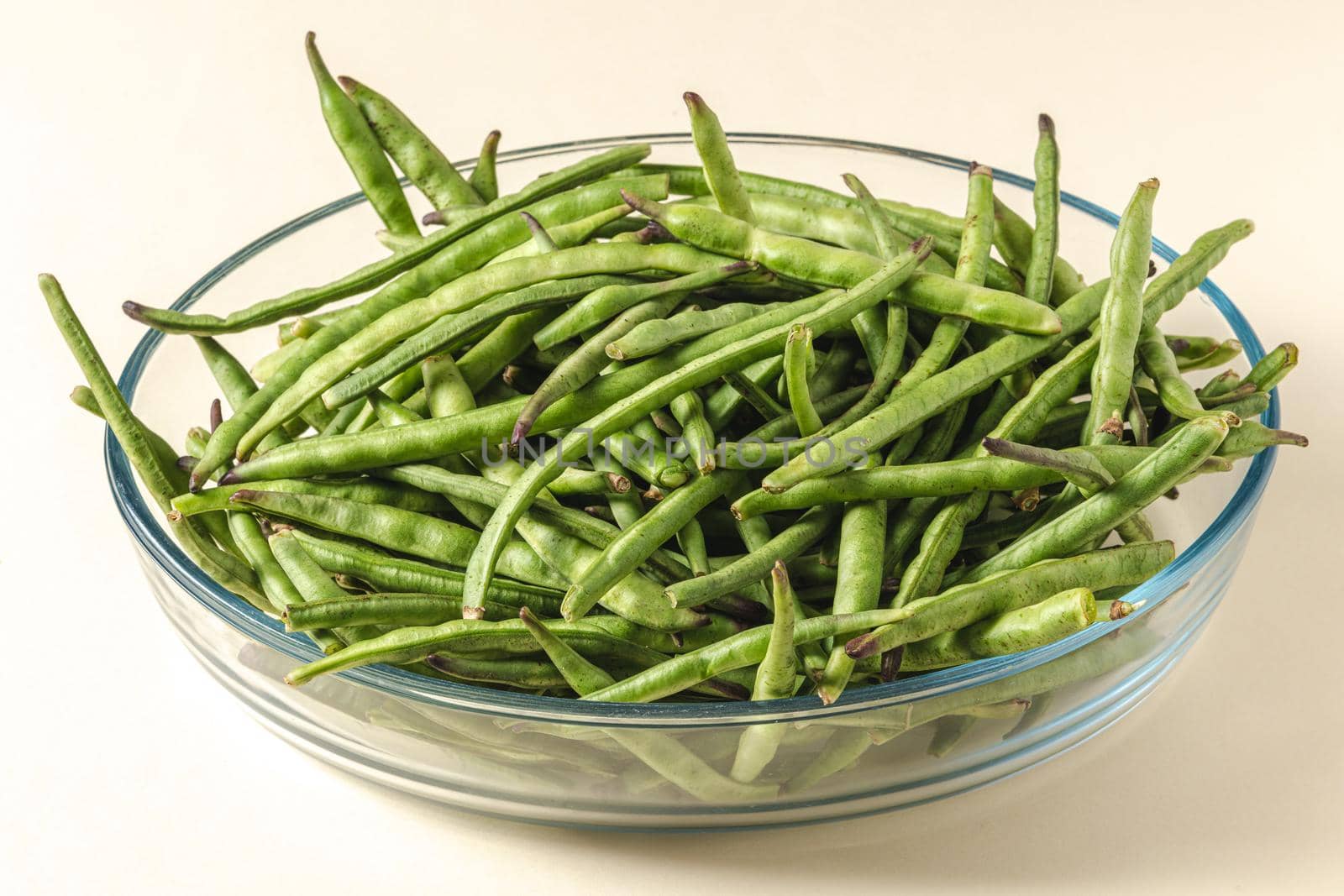 Fresh green beans in a glass bowl. Healthy eating concept