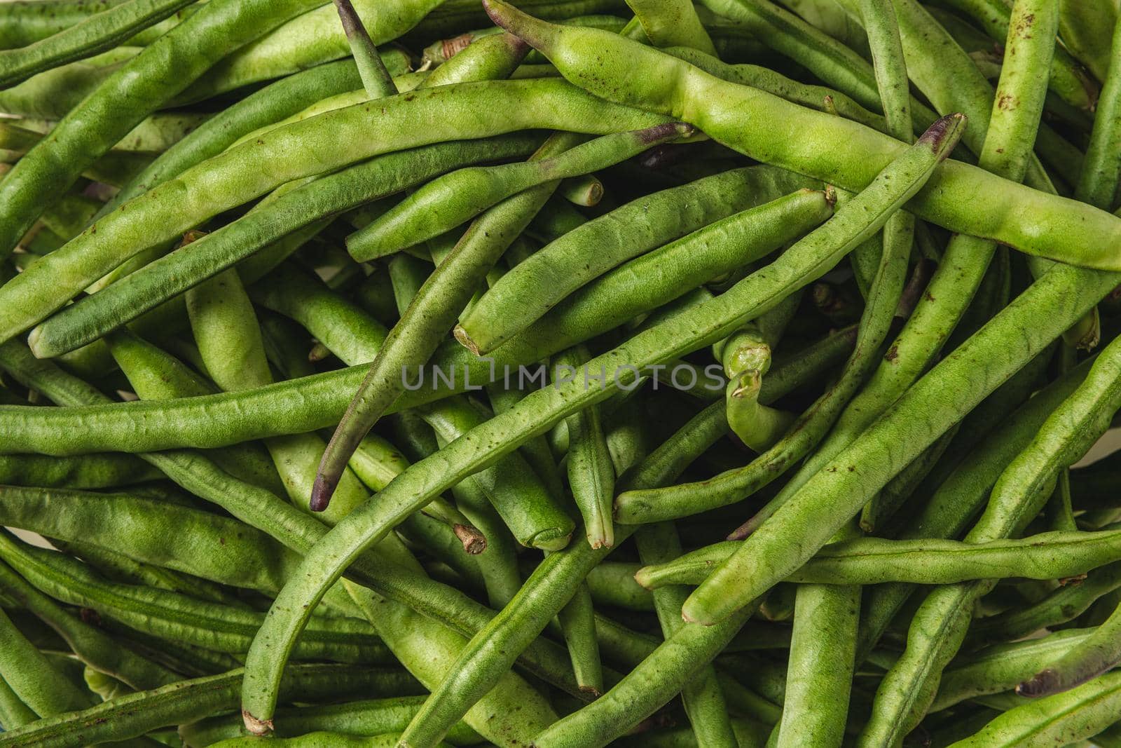 Fresh green beans in a glass bowl. Healthy eating concept by Sonat