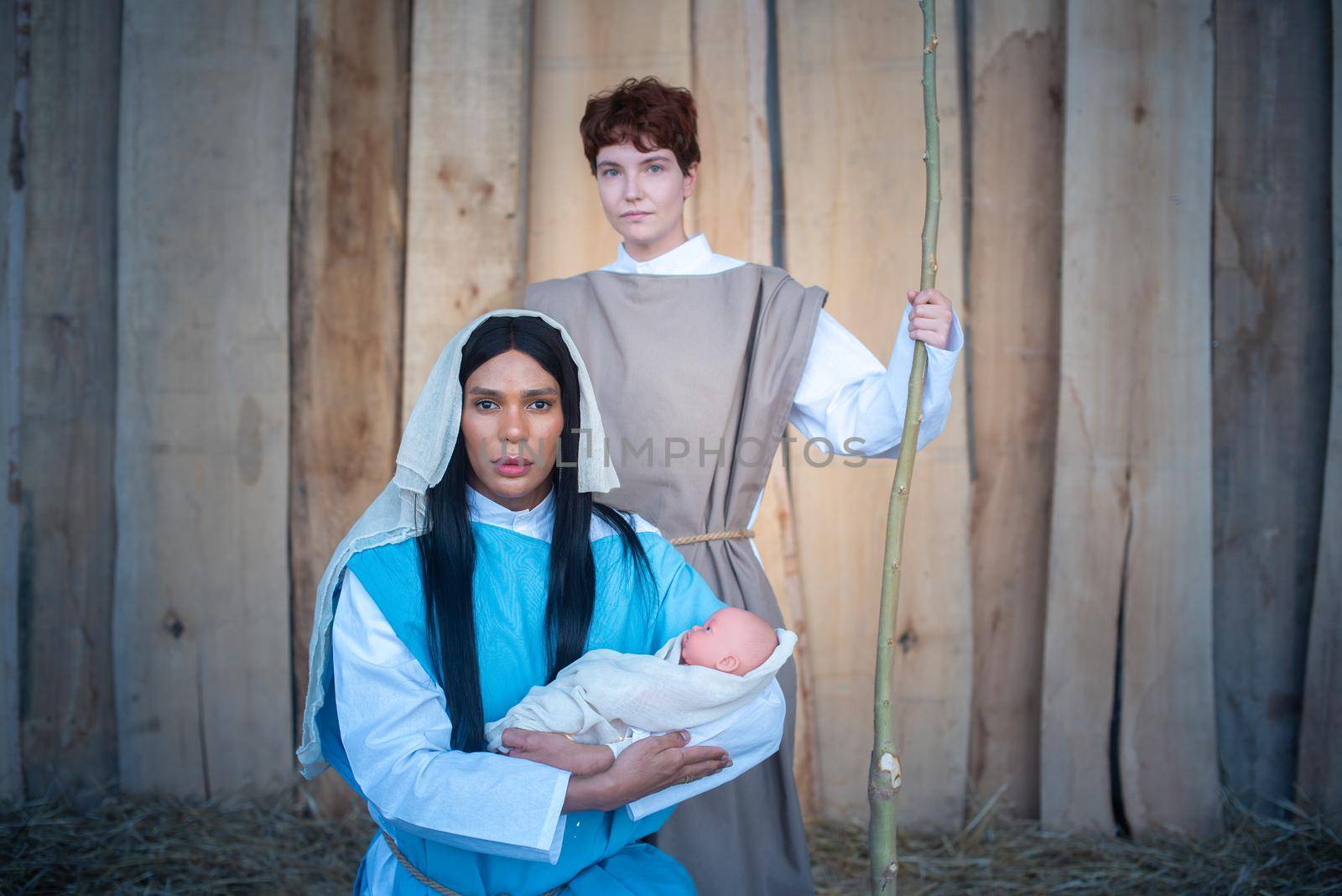 Representation of a transgender nativity scene where the figure of the Virgin Mary holds a baby in her arms