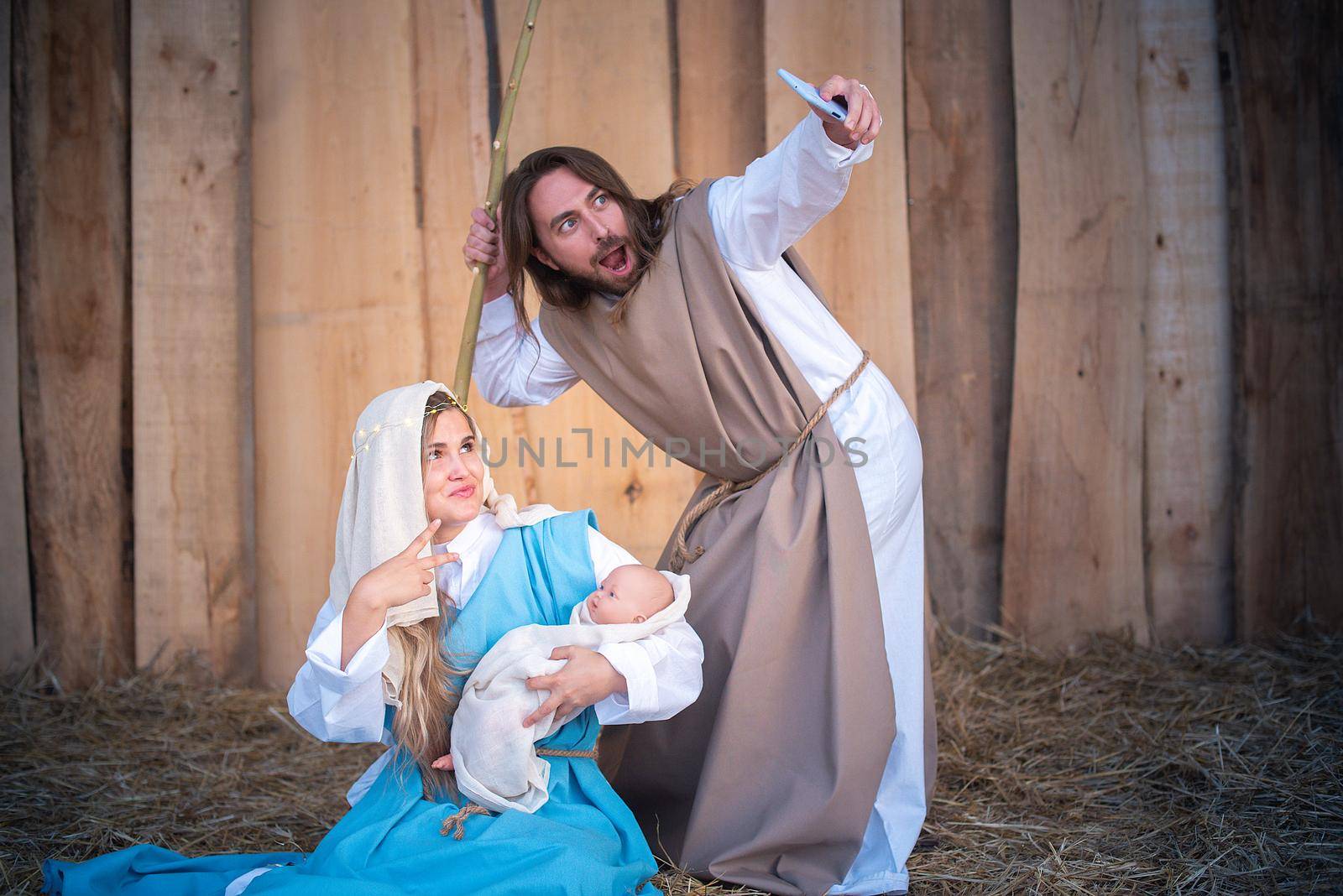 Biblical characters taking a selfie in a nativity scene by ivanmoreno