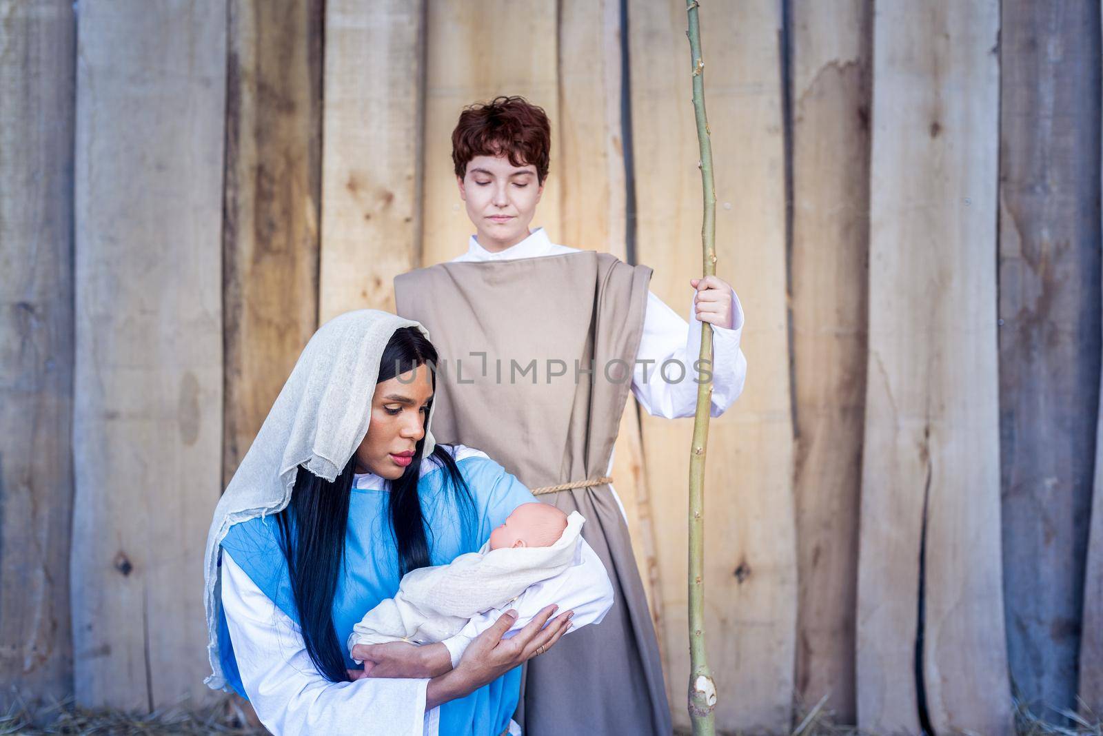 Nativity in transgender version representing a scene where Mary holds Jesus in arms next to Joseph