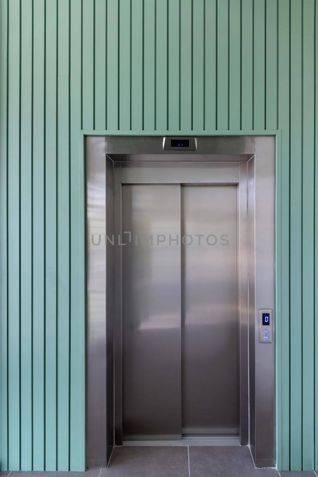 Modern elevator door standing on the ground floor of the business center