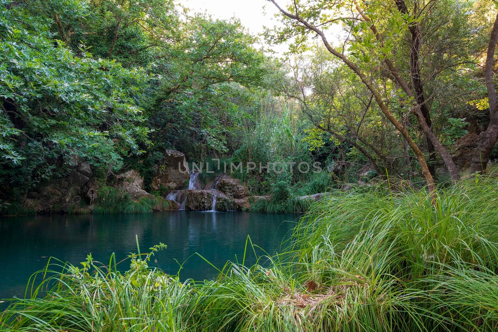 Mountain Lake and Waterfall in Polilimnio area in Messinia, Greece by ankarb