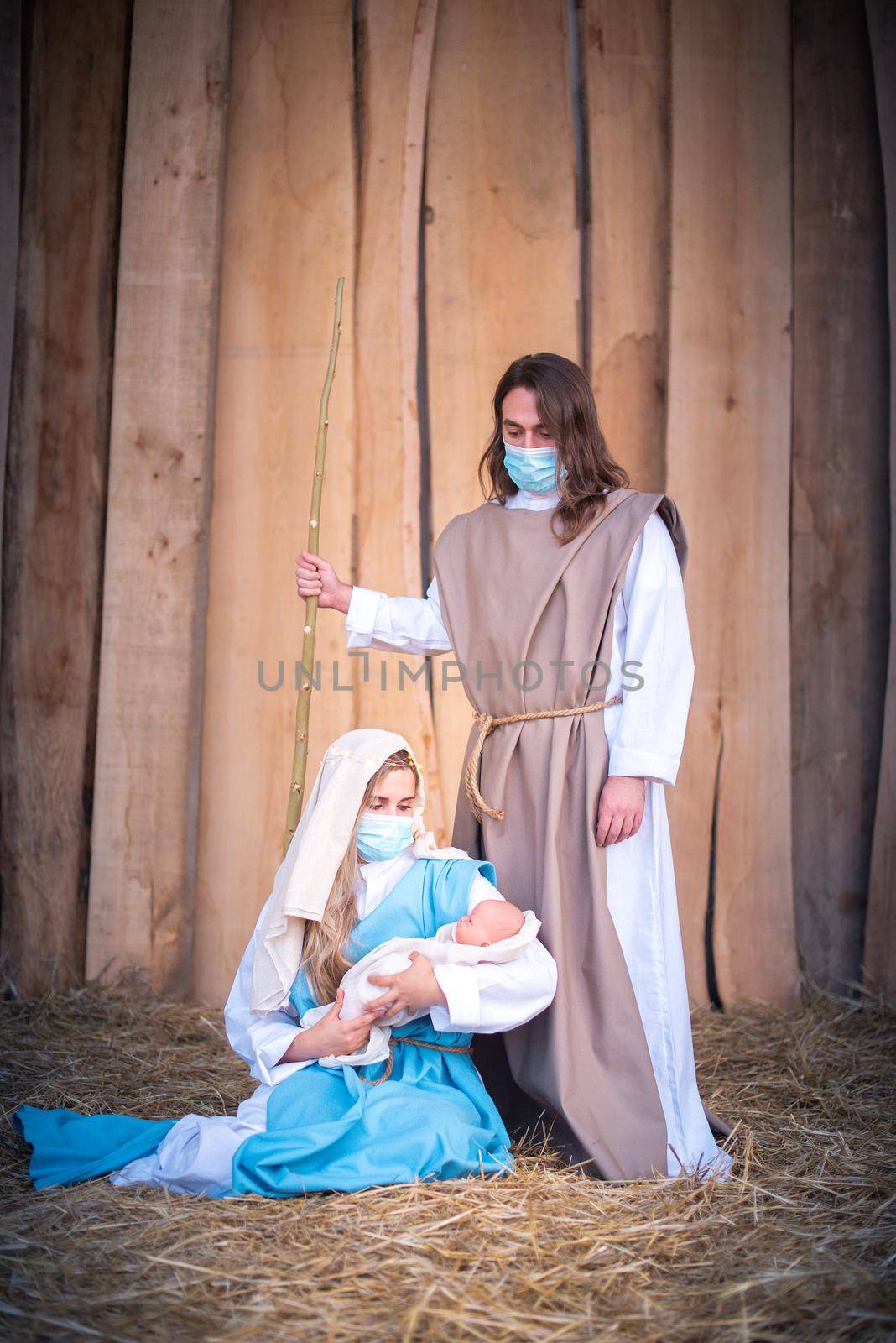 Nativity scene with the characters wearing facial masks by ivanmoreno