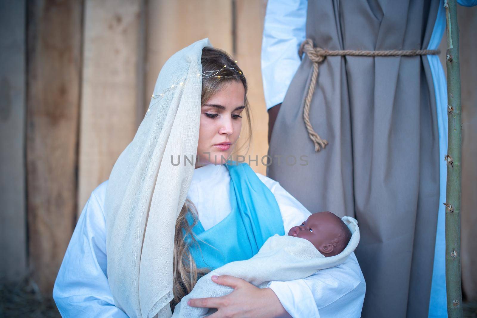 Caucasian virgin mary holding a black baby representing Jesus