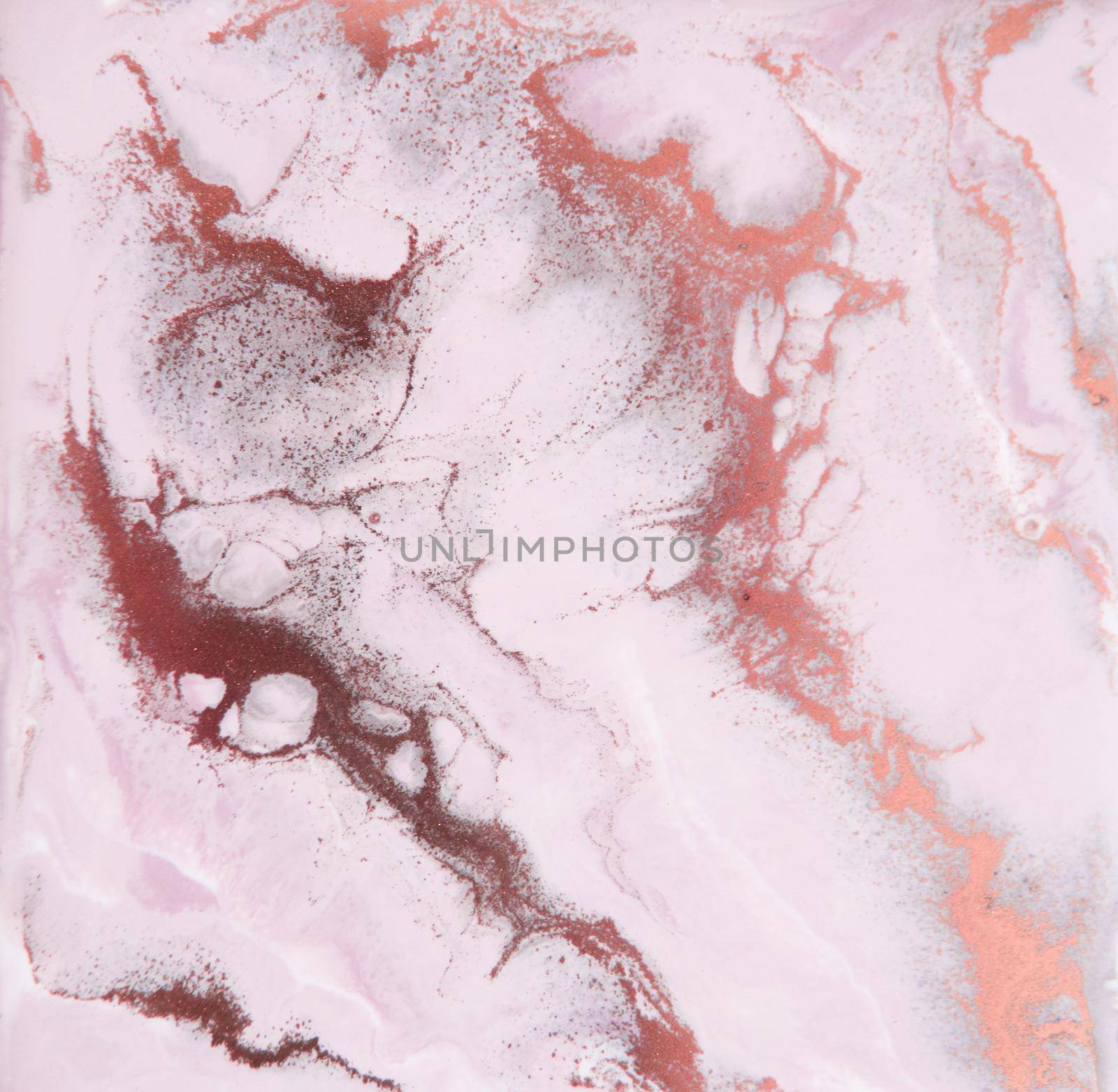 Artistic decoration made of pink resin. Epoxy resin paint, abstract background.