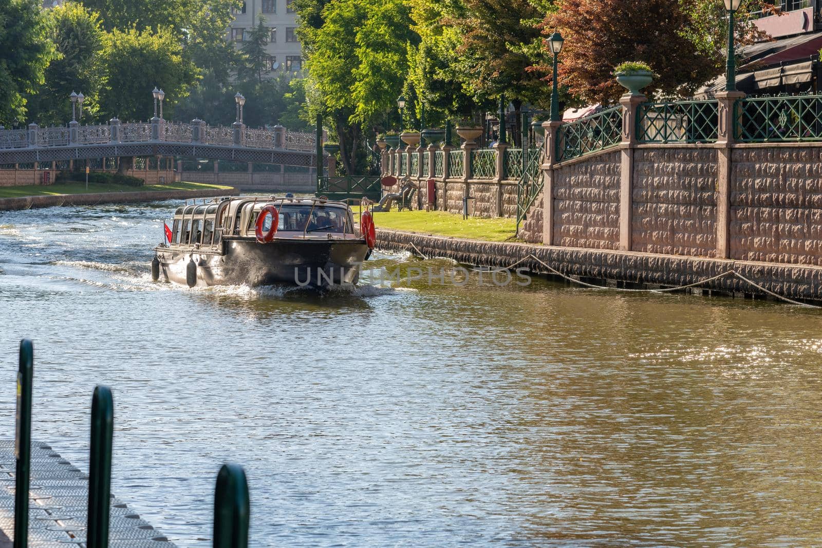 Porsuk creek and touristic boat passing through Eskisehir city center by Sonat