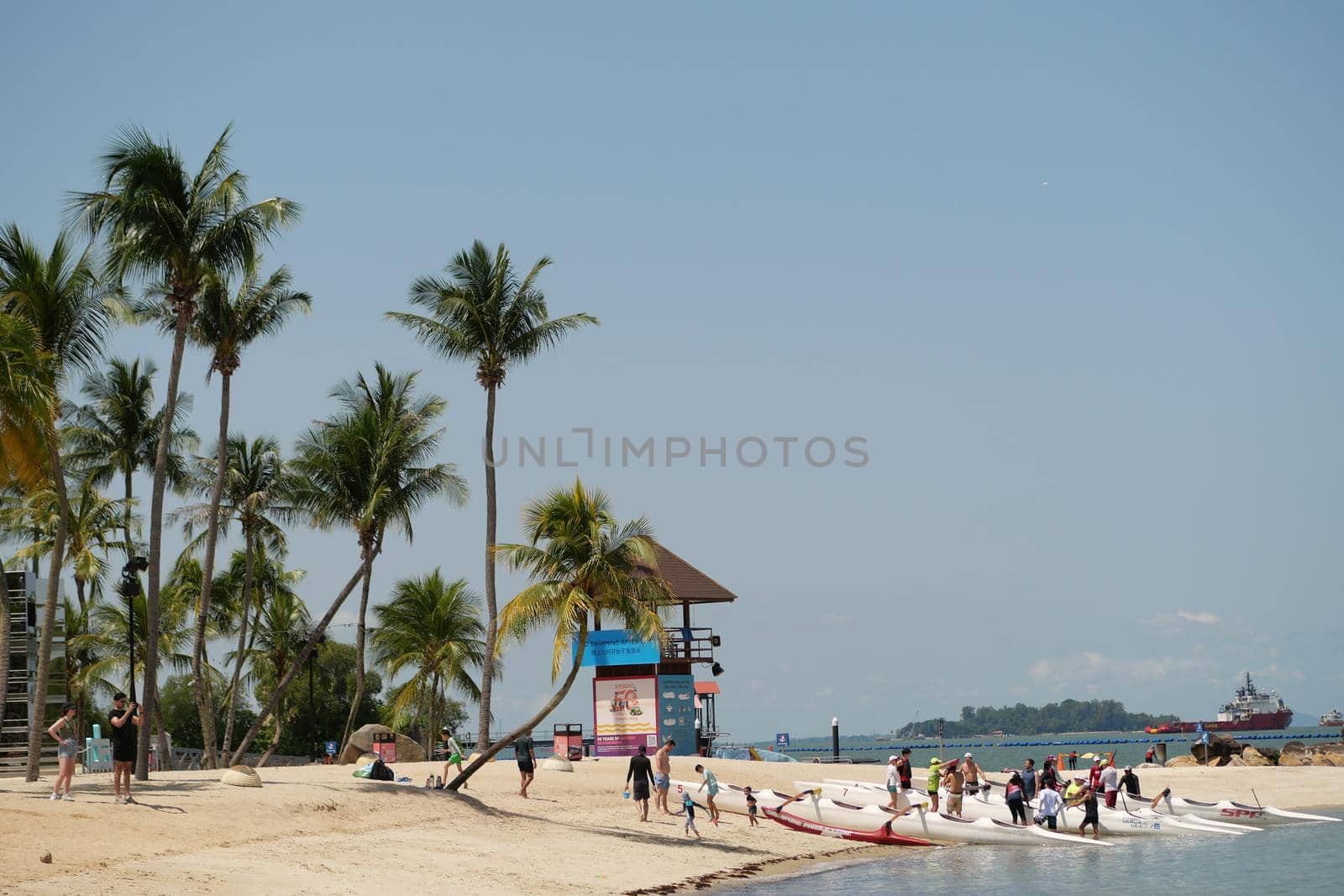 Man relaxing on beach, ocean view, Maldives island. High quality photo