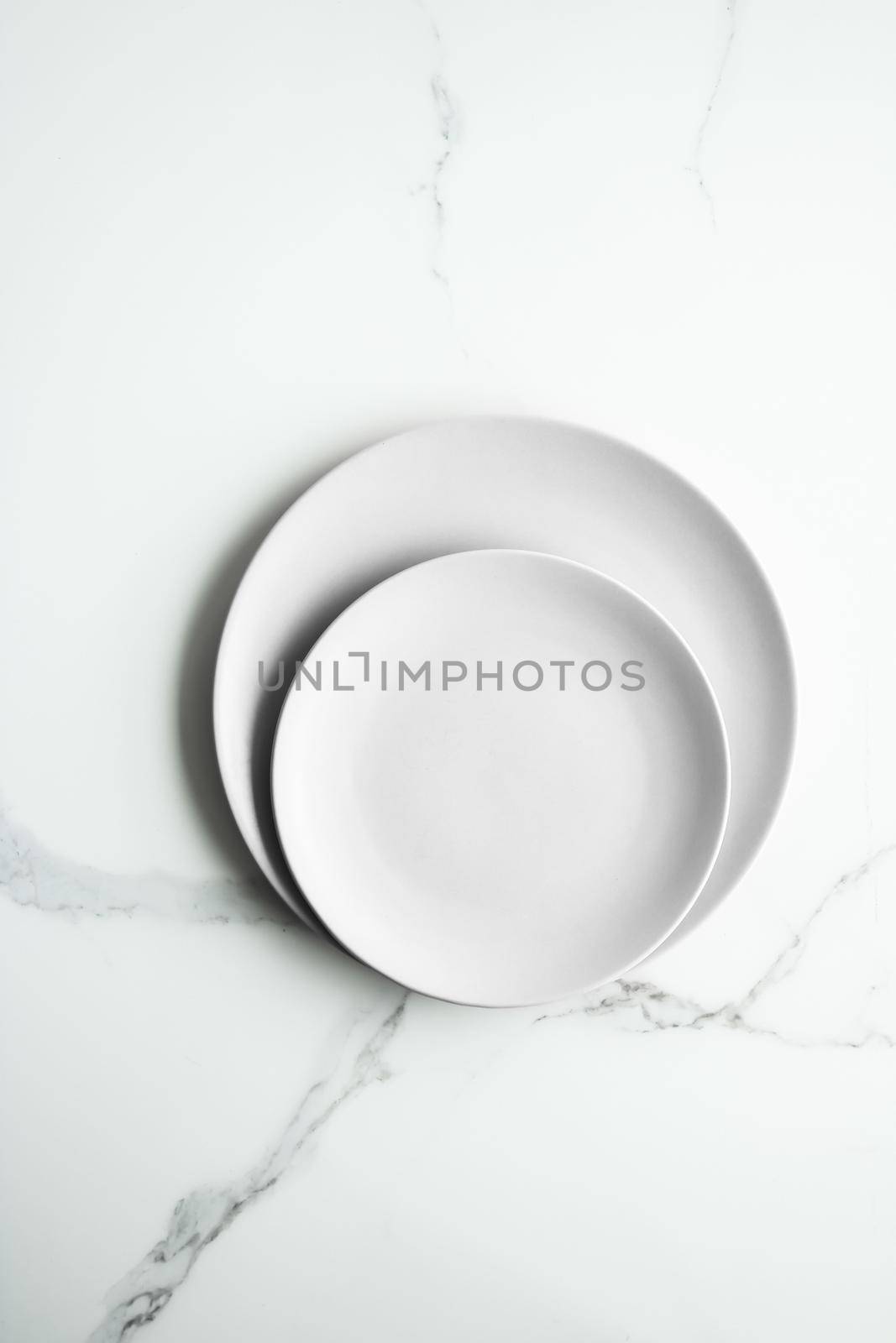 White empty plate on marble, flatlay - stylish tableware, romantic table decor and food menu concept. Serve the perfect dish