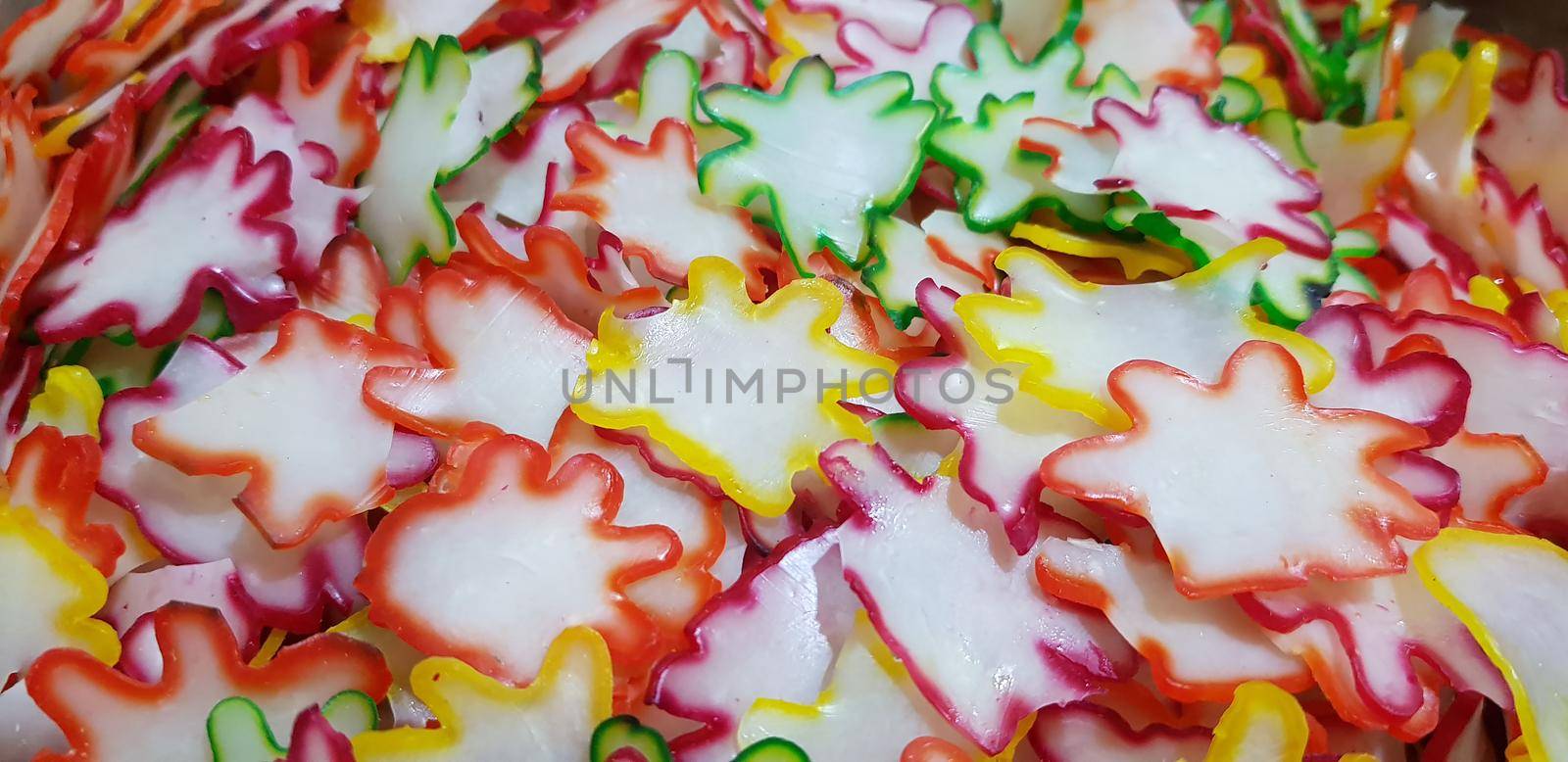 Onion rice flour crackers or Indonesian called it Kerupuk bawang mentah or kerupuk warna-warni or raw kerupuk bawang is rice crackers, Indonesian traditional dish. Selective focus.