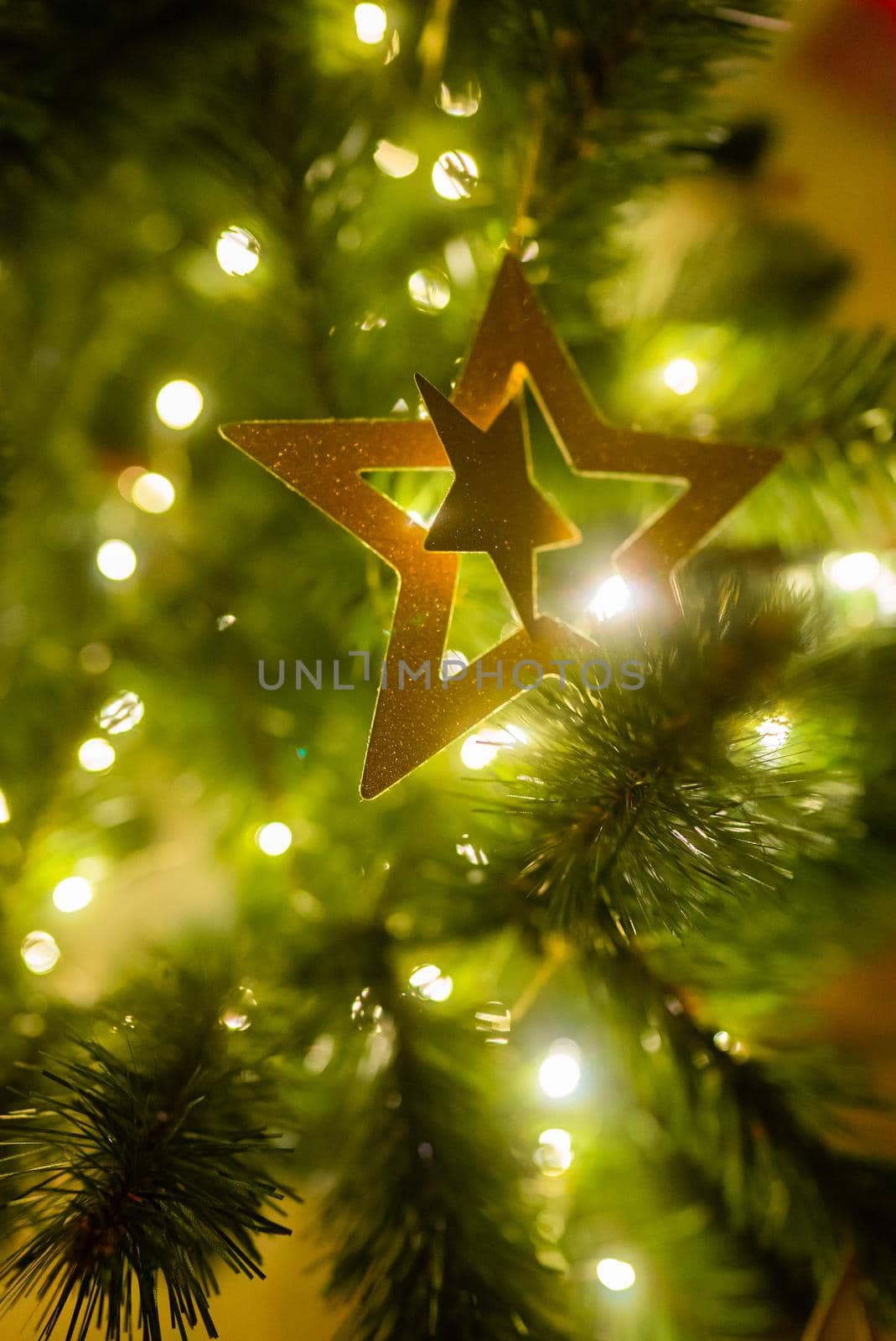 Christmas tree decorated with star, balls and toys. Wall background, New year banner concept. High quality photo