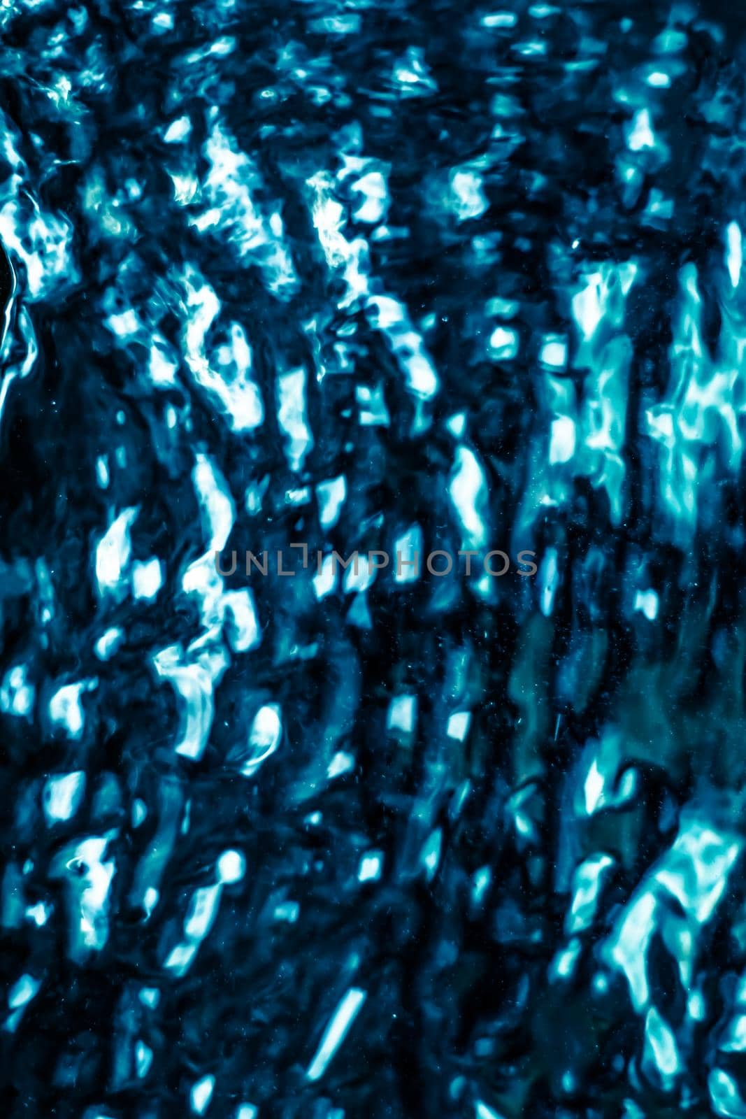 Abstract blue liquid surface as background - futuristic design and science concept. Deep blue waters