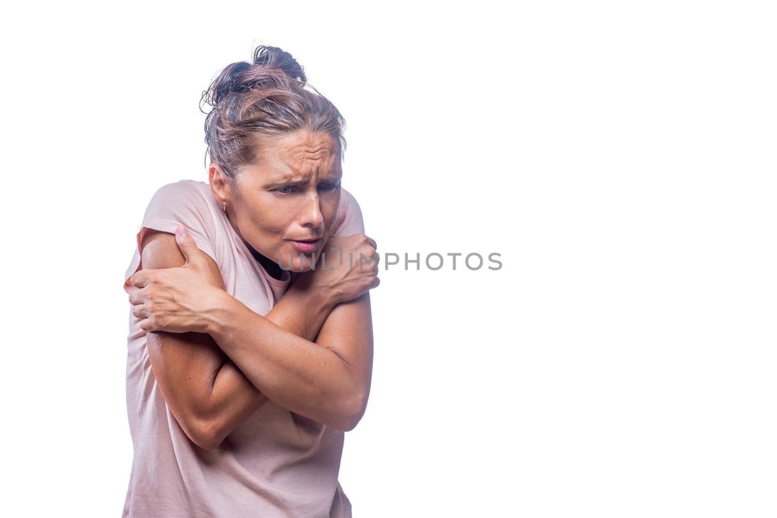 Front view of a freezing woman on a white background with copy space.