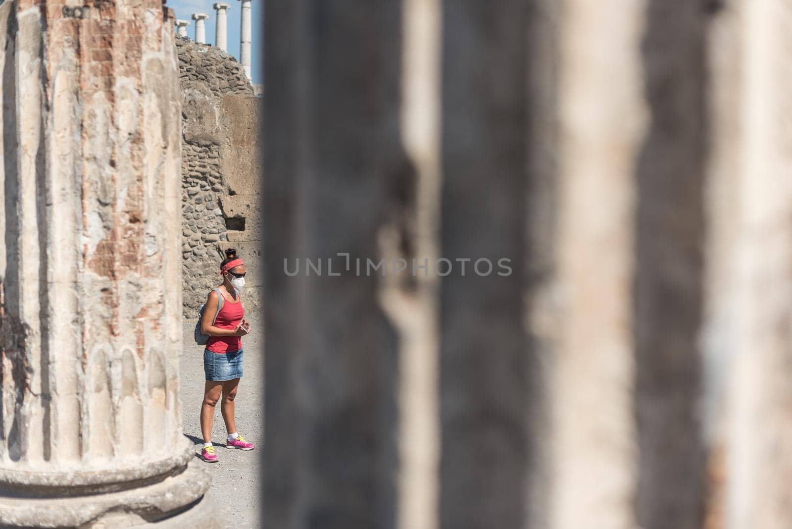 Woman watching the Roman archaeological site of Pompeii, in Italy.