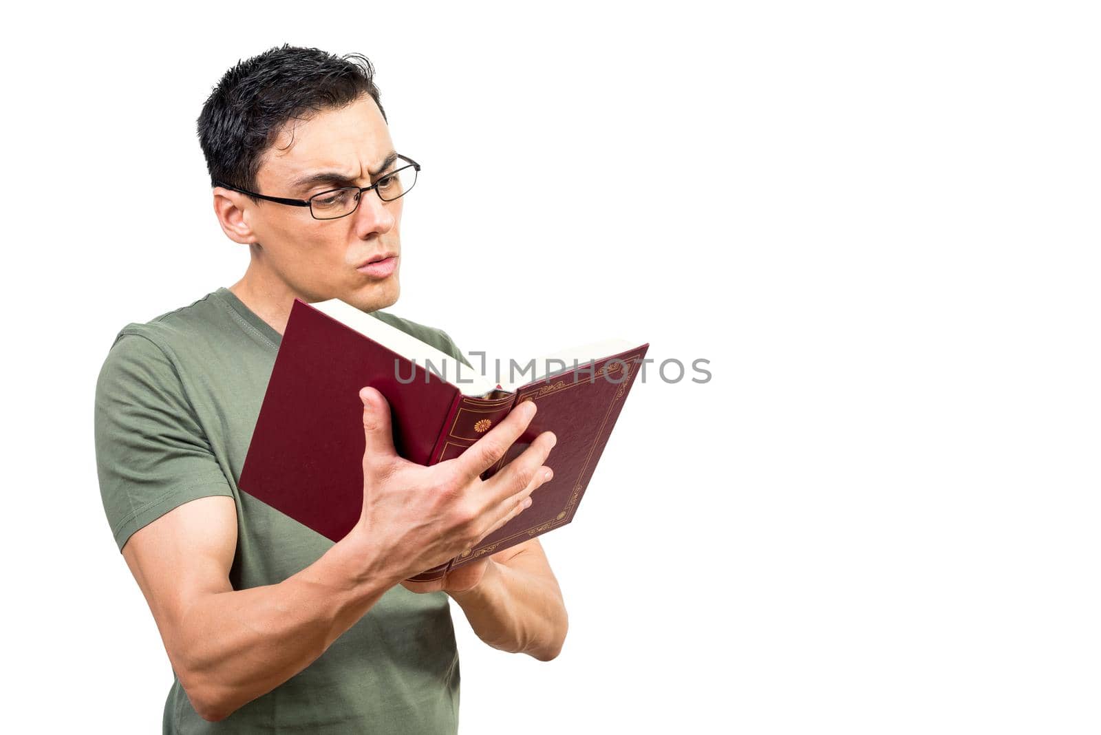 Concentrated intelligent male in eyeglasses reading volume of interesting novel on white isolated background