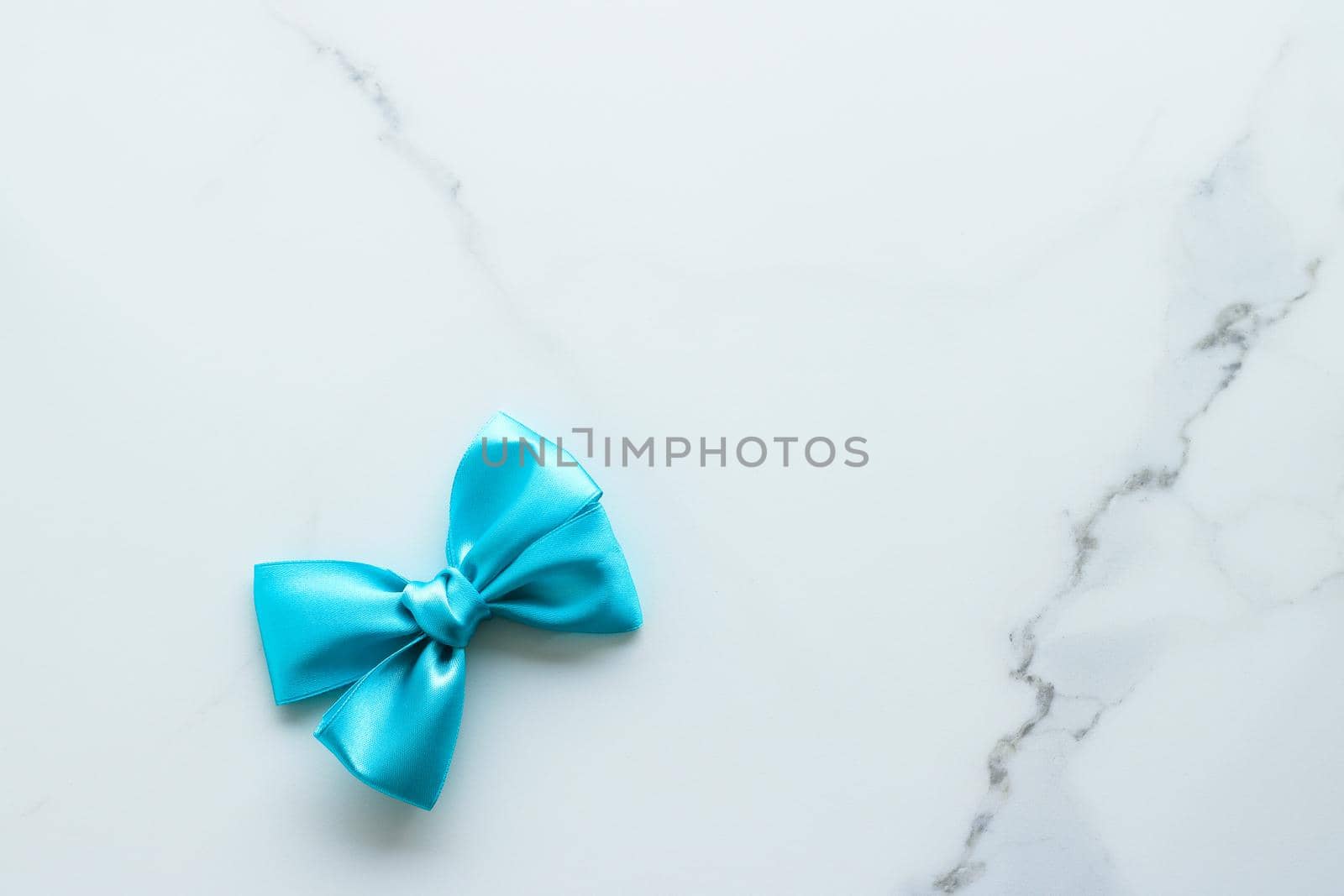 Holiday decor, feminine design and flatlay concept - Blue silk ribbon on marble, top view