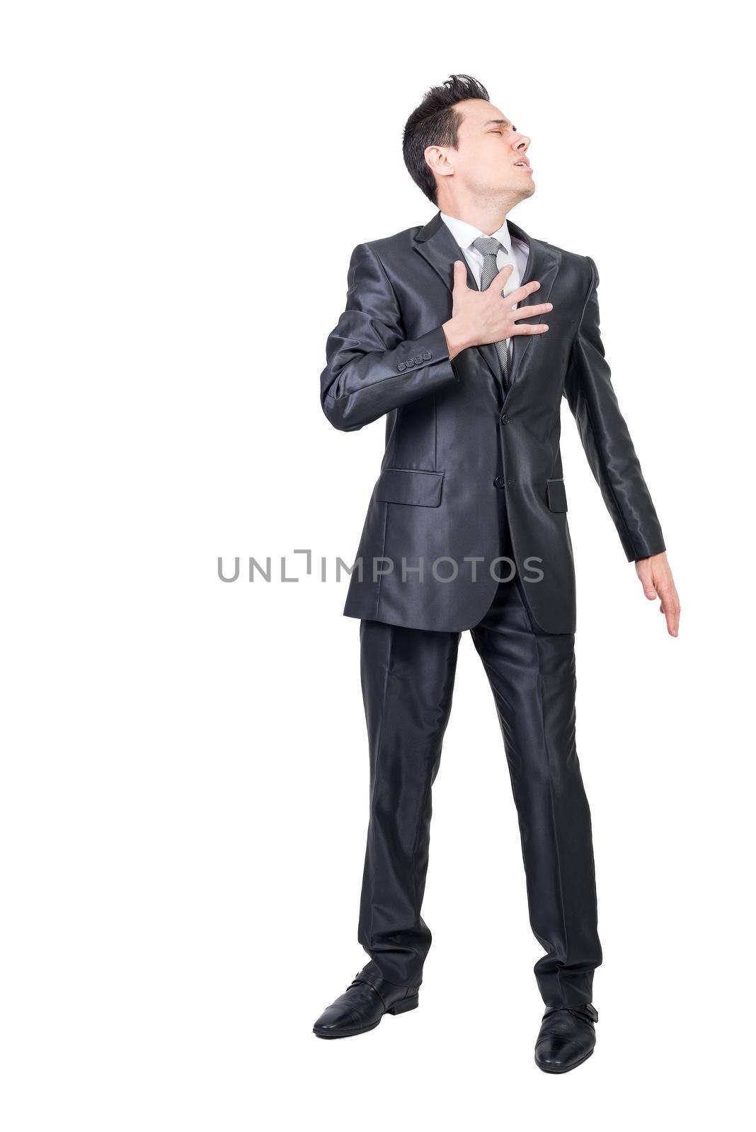 Comic male entrepreneur in formal clothes touching chest and feeling pain on white isolated background