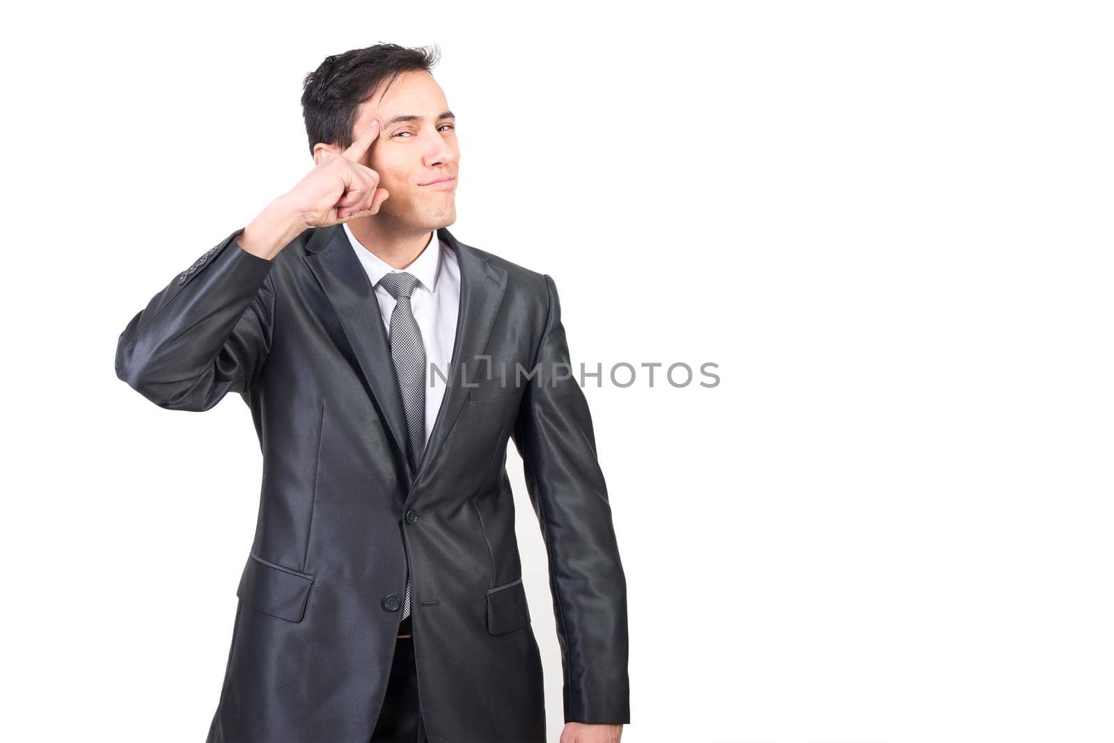 Smart male in elegant outfit making think gesture and pointing to head while looking at camera isolated on white background