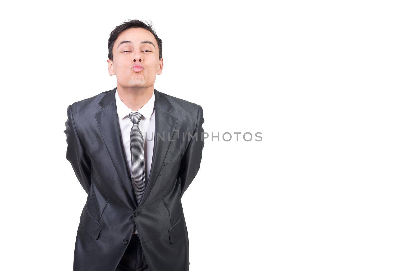 Loving man in suit sending air kiss by ivanmoreno