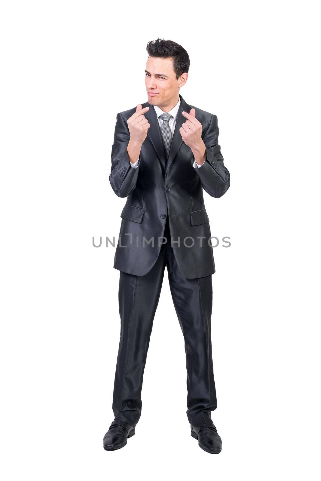 Full body of content rich male in formal suit looking at camera with money gesture isolated on white background in studio