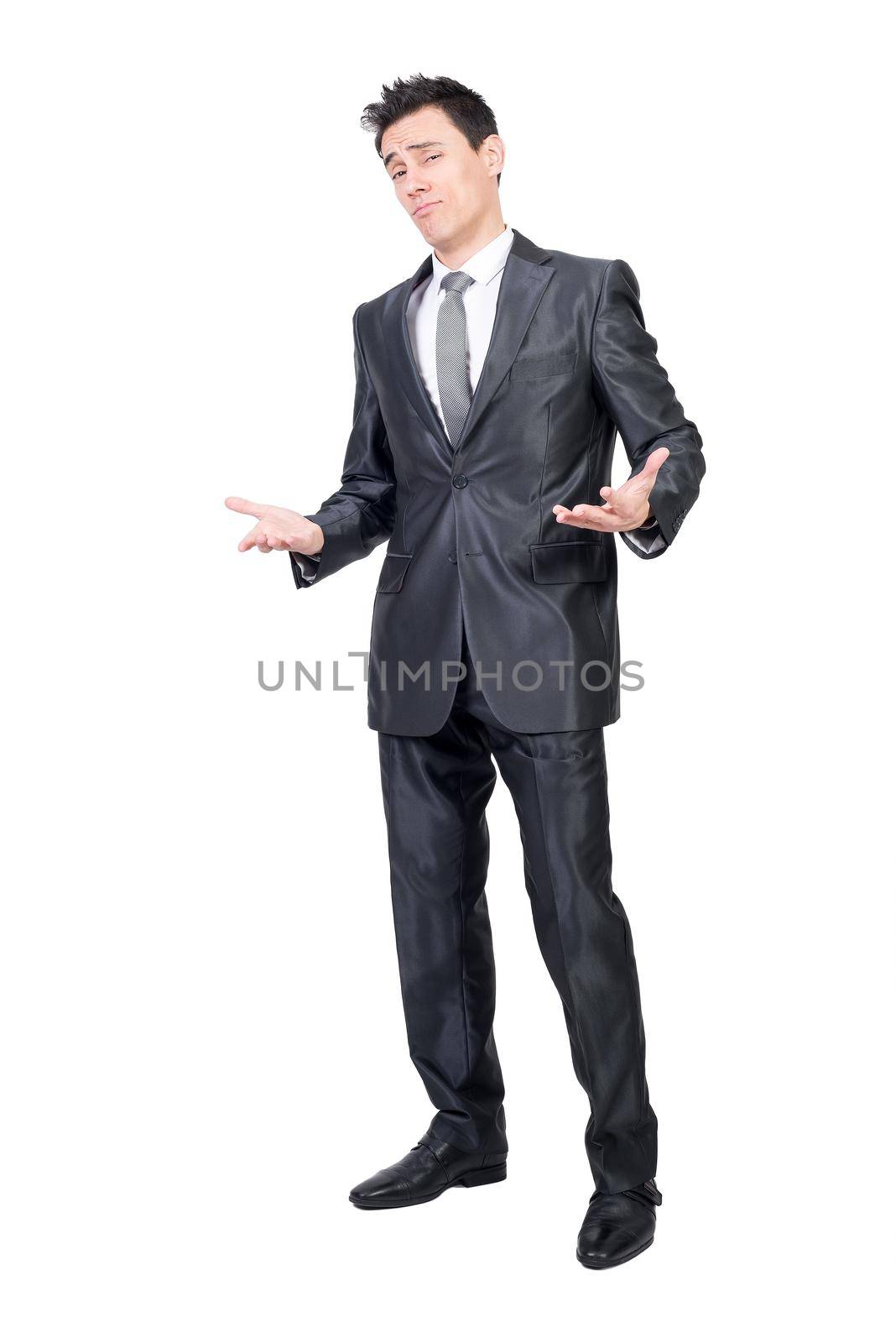 Full body of alluring man in formal suit looking at camera with palms up isolated on white background in studio