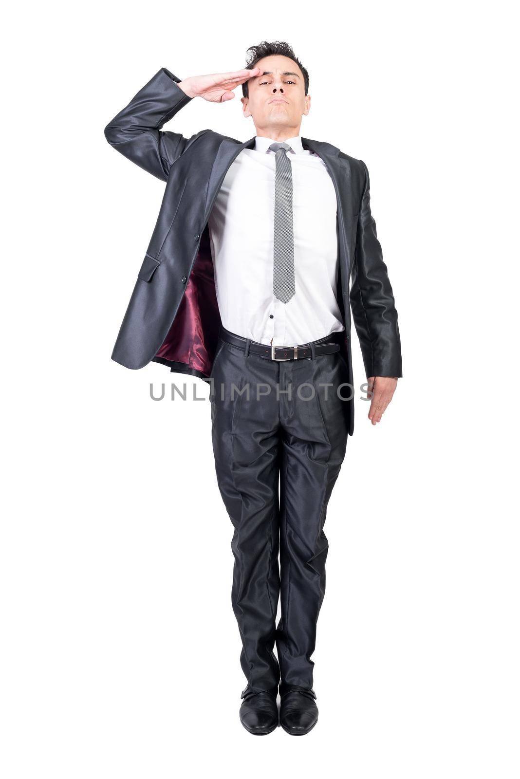 Full body of male soldier in elegant suit saluting and looking at camera with serious face isolated on white background