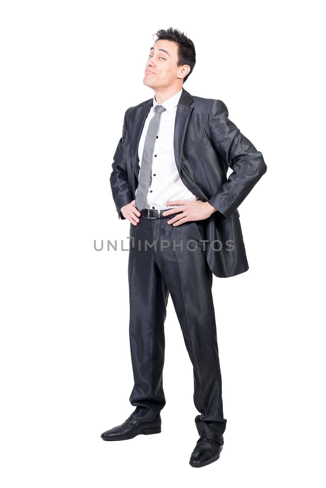 Full body of glad male in formal suit looking at camera with smile and hands on waist isolated on white background