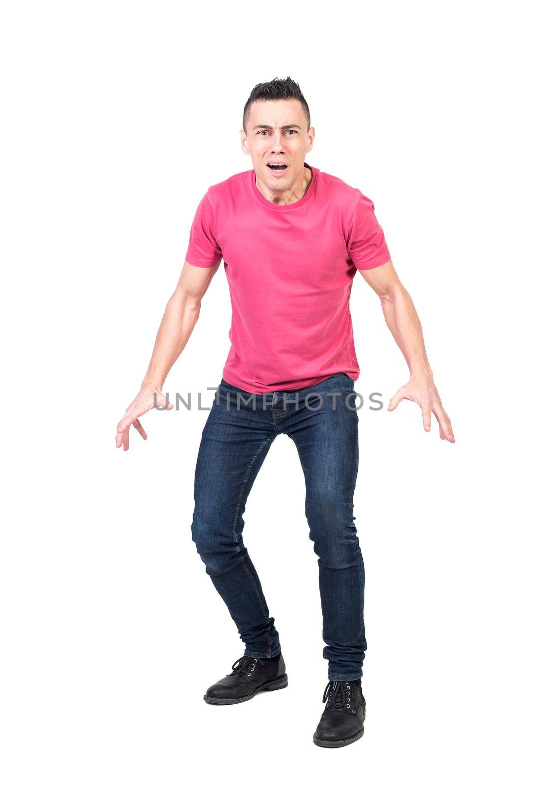 Full body afraid man in casual clothes looking at camera with opened mouth and preparing to run away isolated on white background