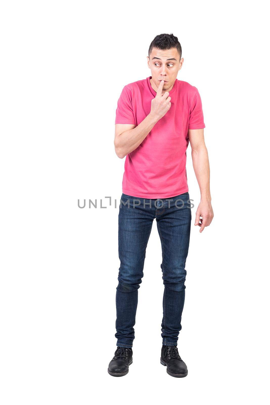 Full length male in casual clothes touching lips and looking away while trying to get away with failure against white background