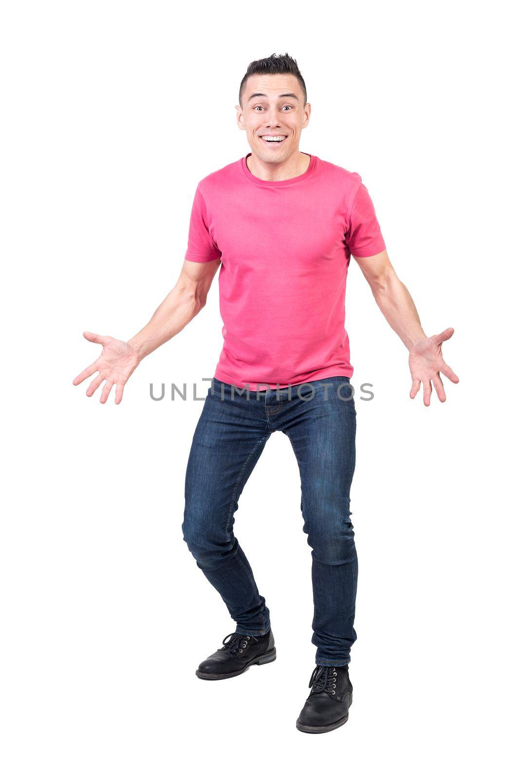 Full body of positive male in casual clothes looking at camera with astonished face expression isolated on white background in studio