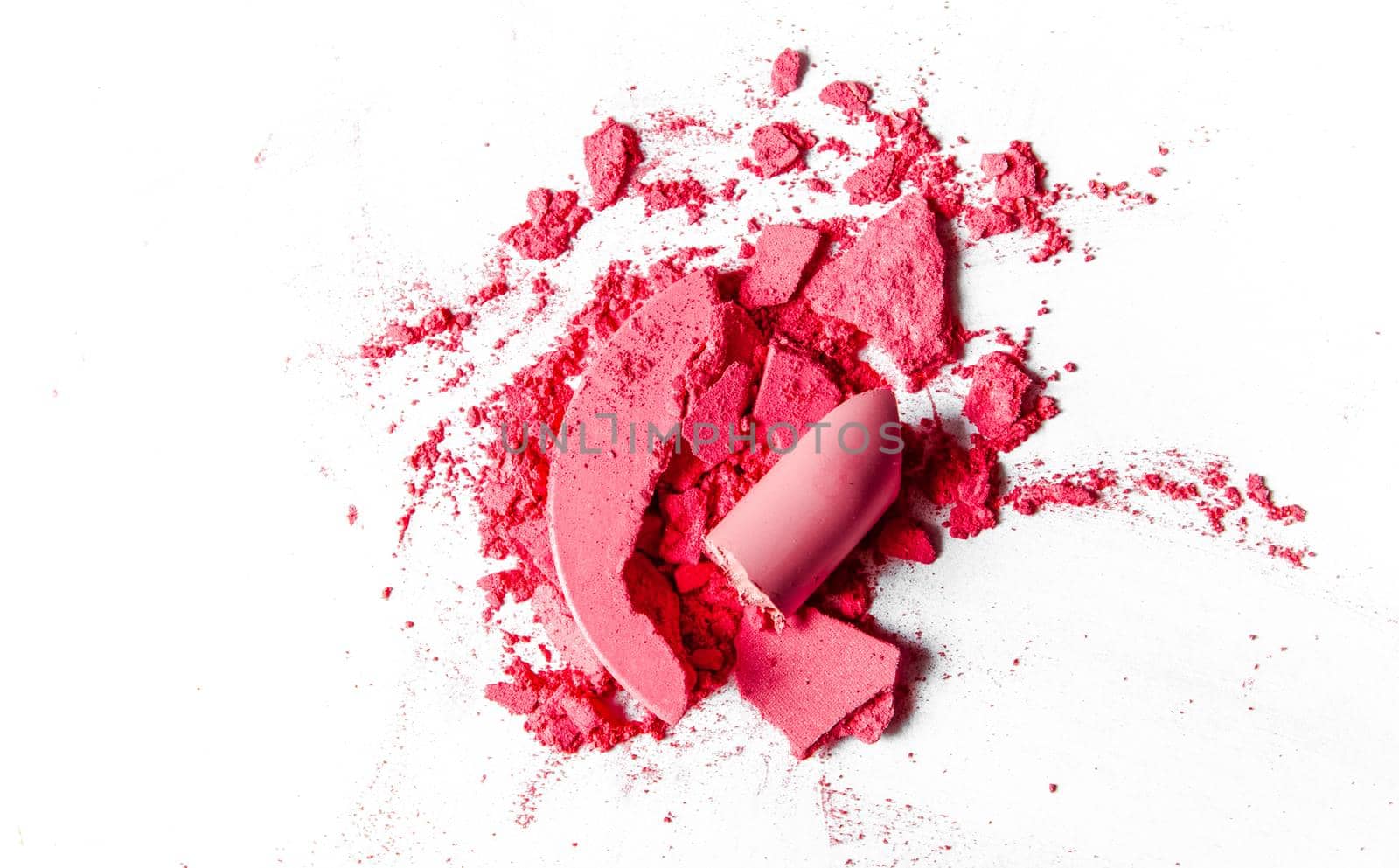 Beauty texture, cosmetic product and art of make-up concept - Crushed eyeshadows, lipstick and powder isolated on white background