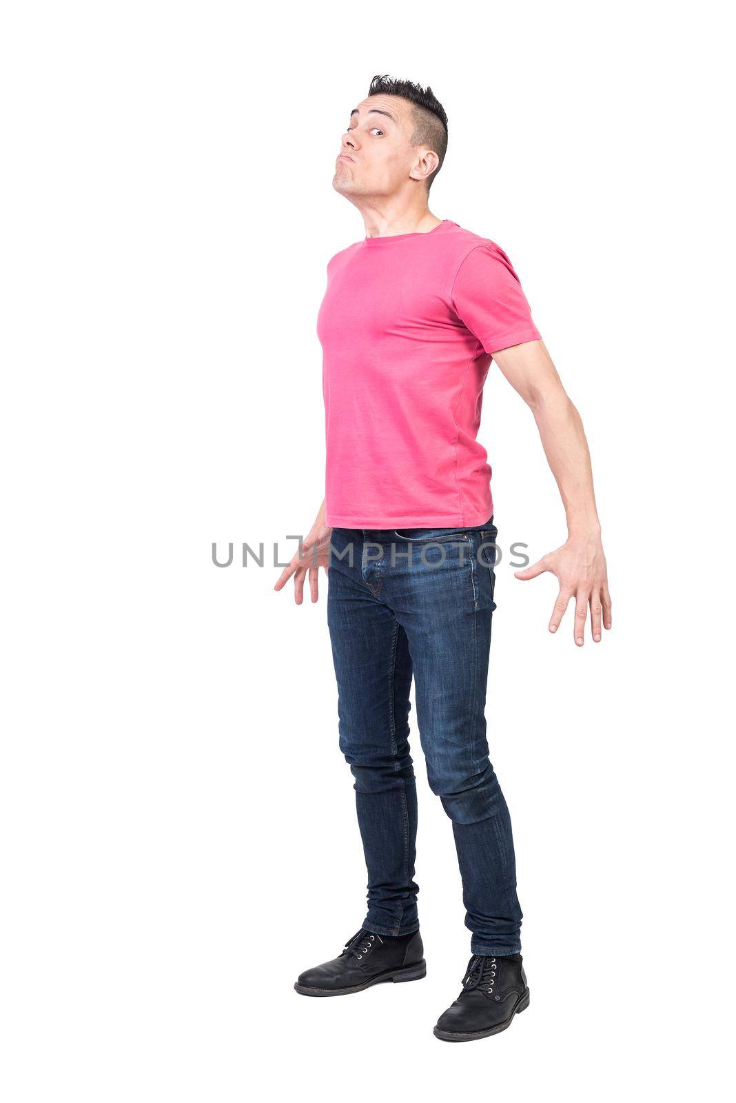 Full body of displeased male model with angry face expression showing negative reaction on white background